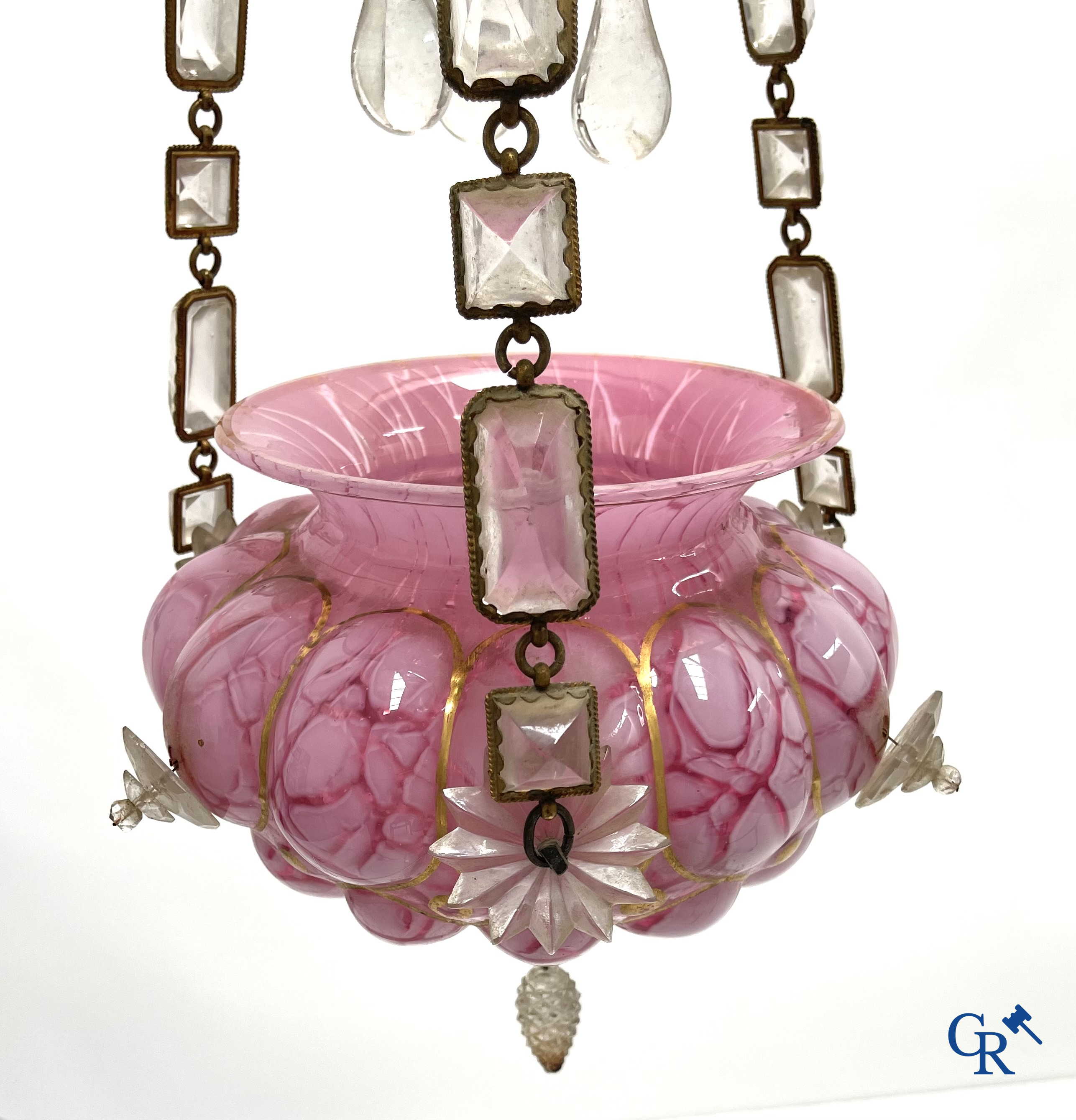 A chandelier in pink opaline and gilded frames with mounted crystal in the style of Baccarat. Circa 1860.
