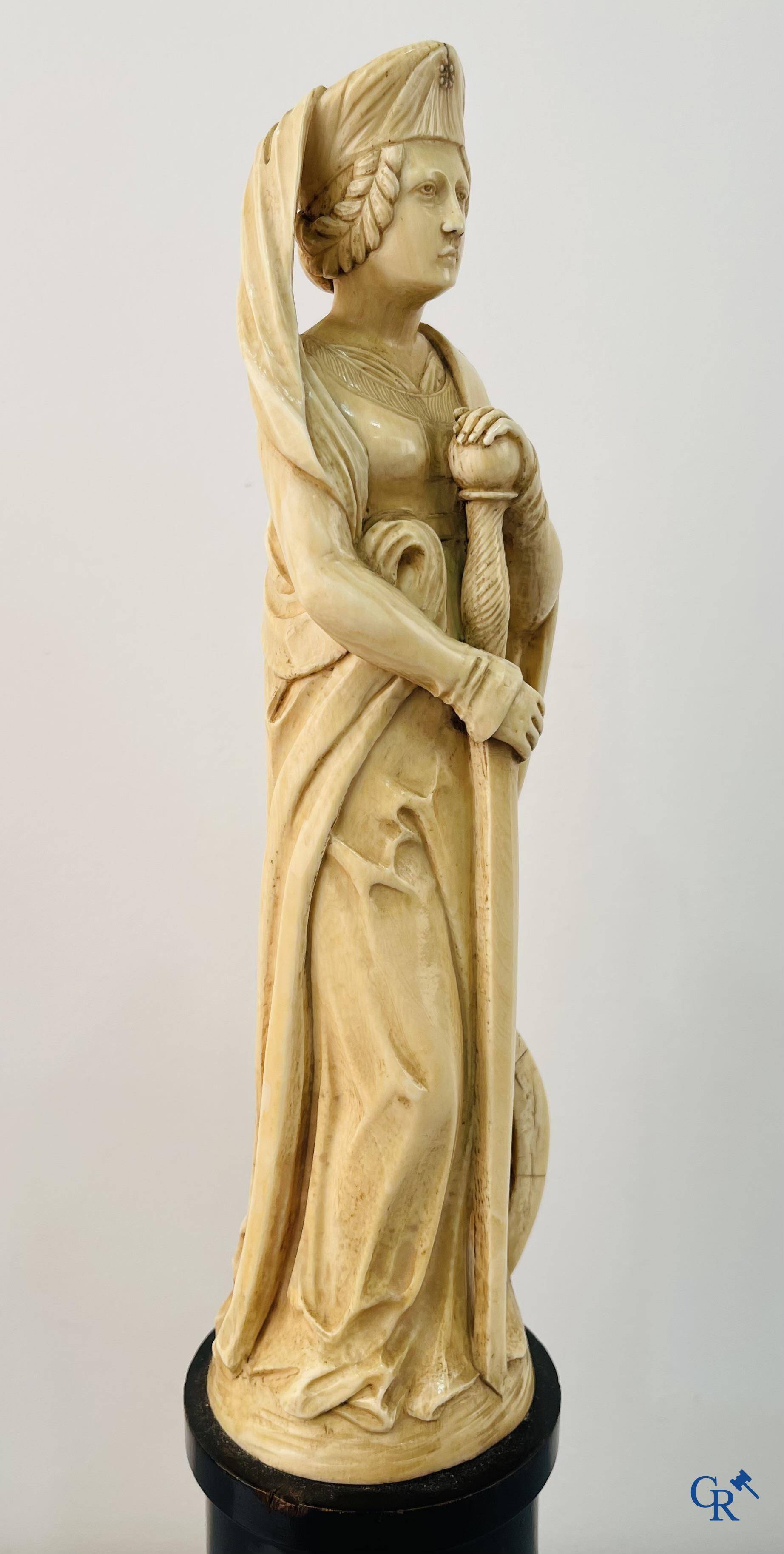 Dieppe, French work, early 19th century. Representation of Catherine of Alexandria in ivory on a pedestal.