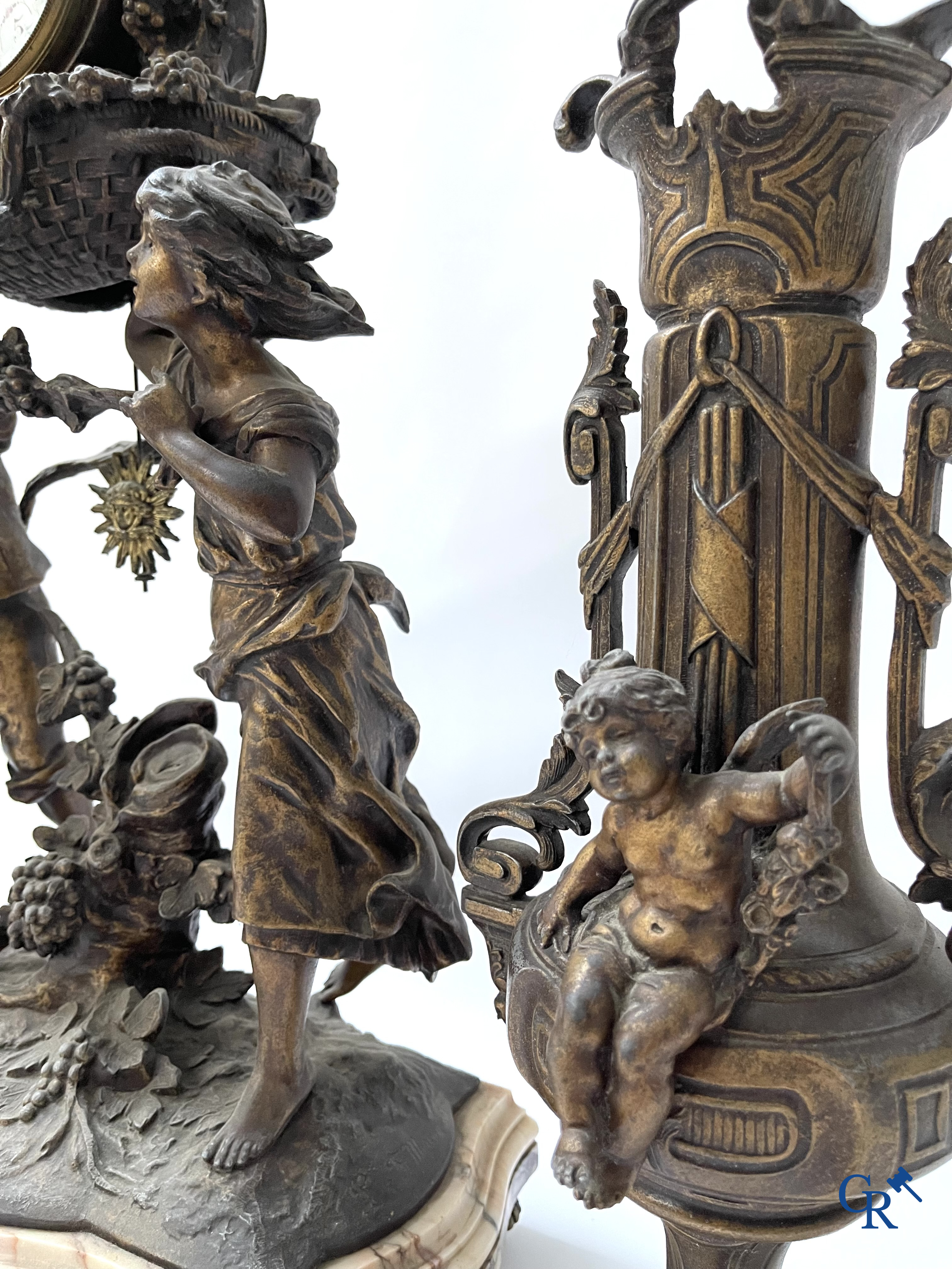 Louis & François Moreau (after). A large 3-piece fireplace set in spelter and marble. Circa 1910.