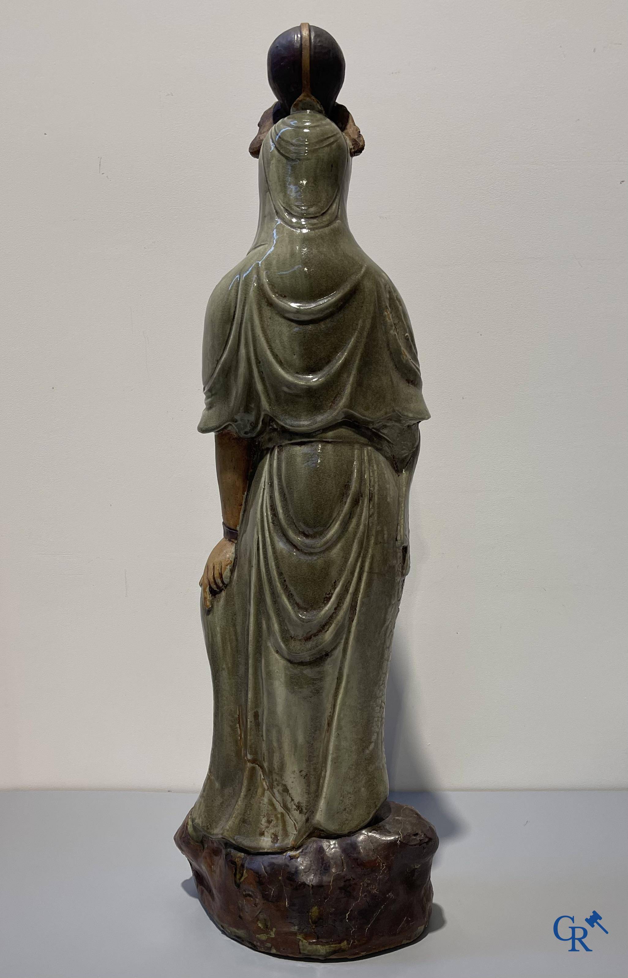 Asian Art, an imposing Shiwan earthenware figure of Guanyin.