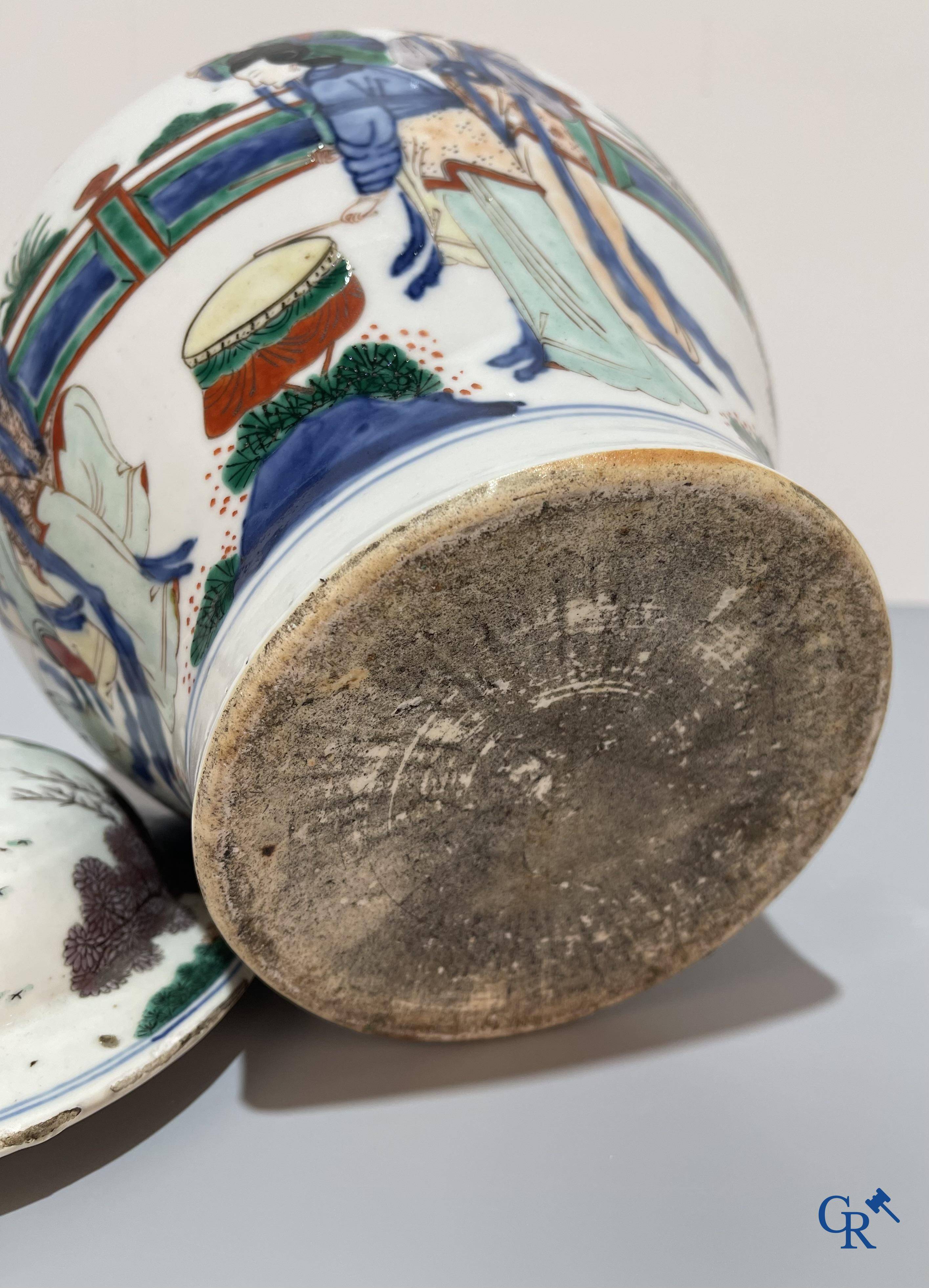 Asian Art, Chinese porcelain, a Chinese Wucai lidded vase with characters.