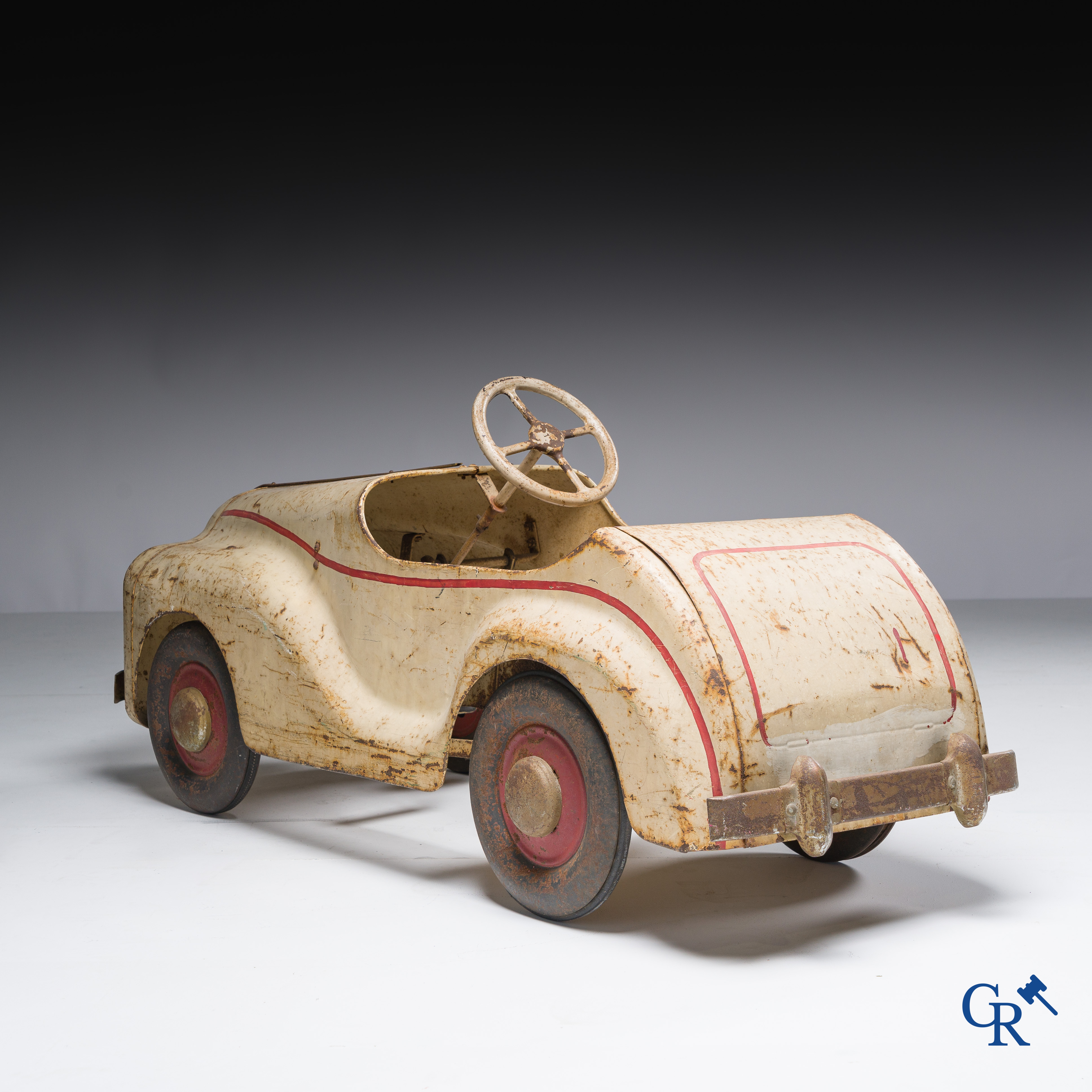 Tri-Ang. Metal pedal car in original condition. Circa 1950.