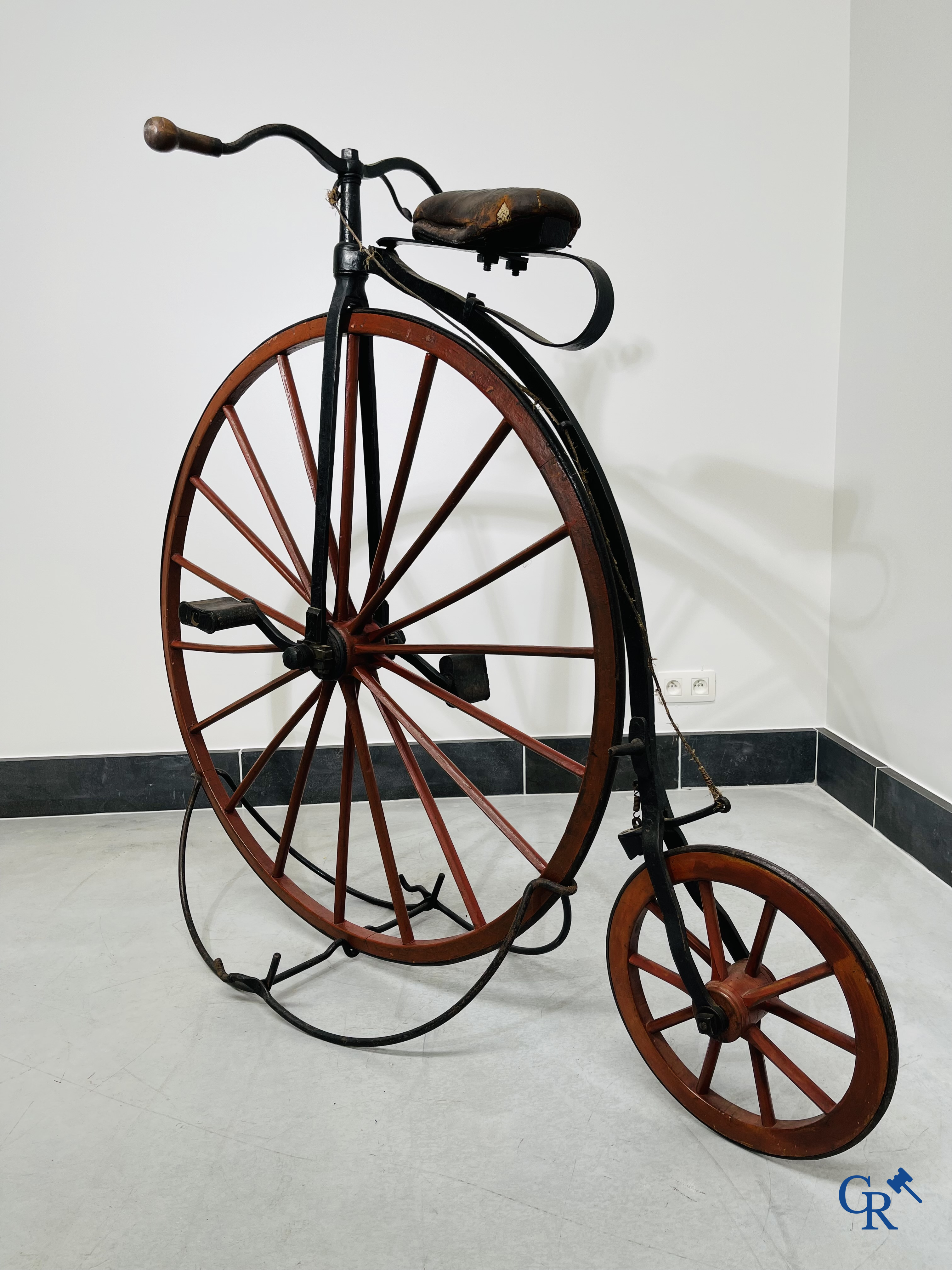 Penny-farthing with wooden spoked wheels on the original wrought iron upright. Circa 1880.