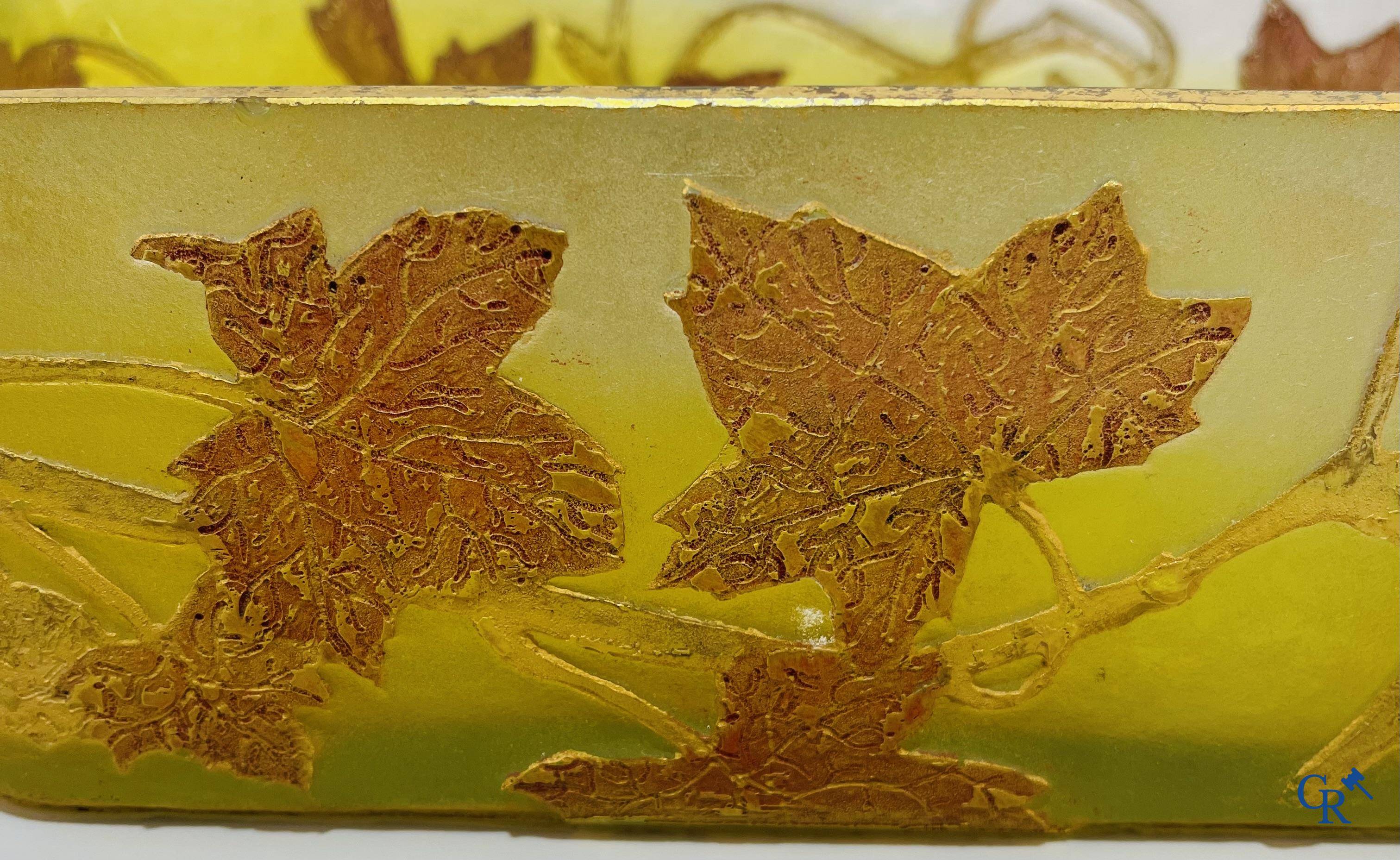 Daum Nancy. Large jardiniere in cameo glass with a decor of chestnut branches on a yellow relief background.