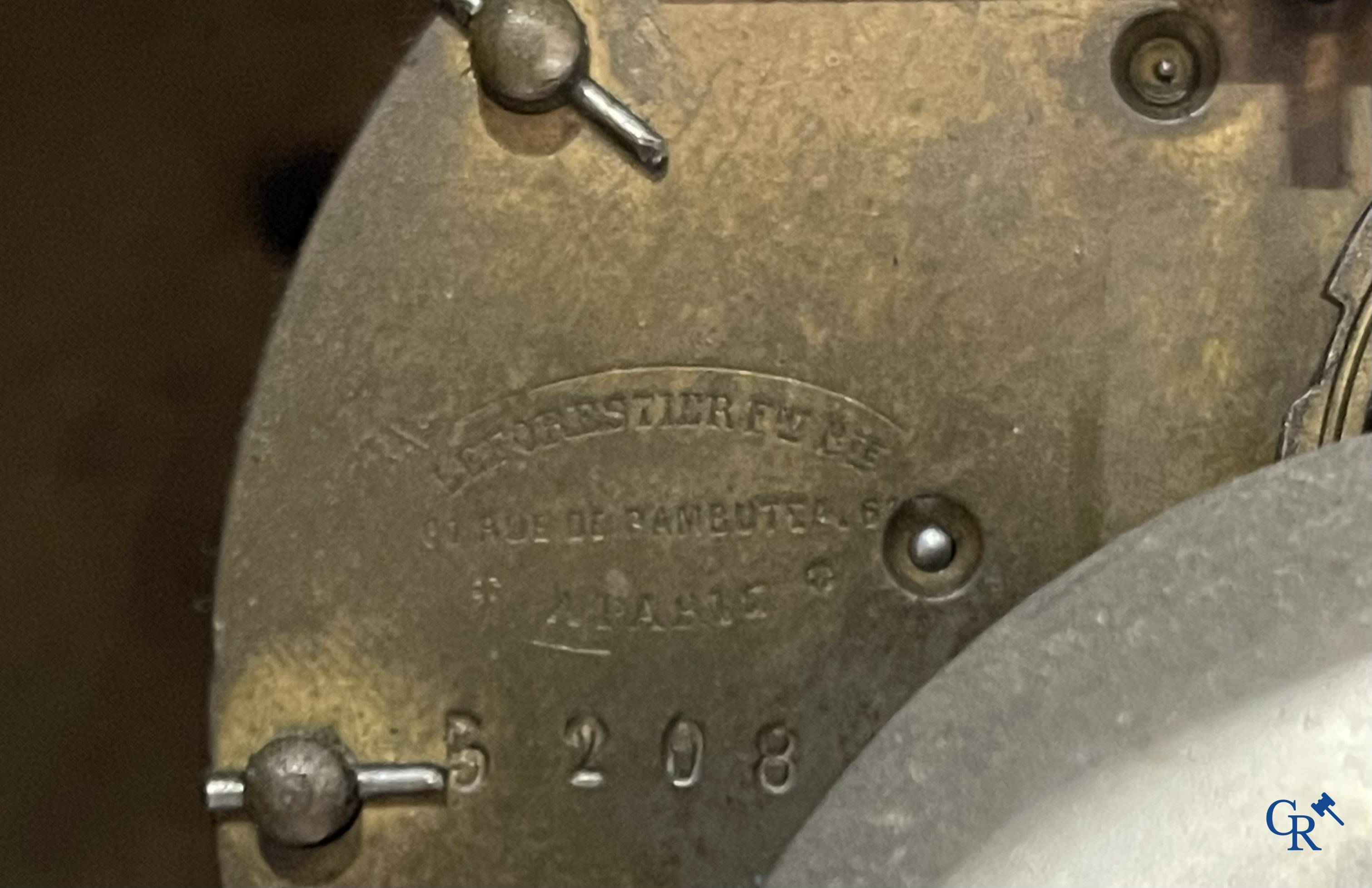 A finely carved walnut clock in so-called "black forest" carving. French work circa 1860-1880.