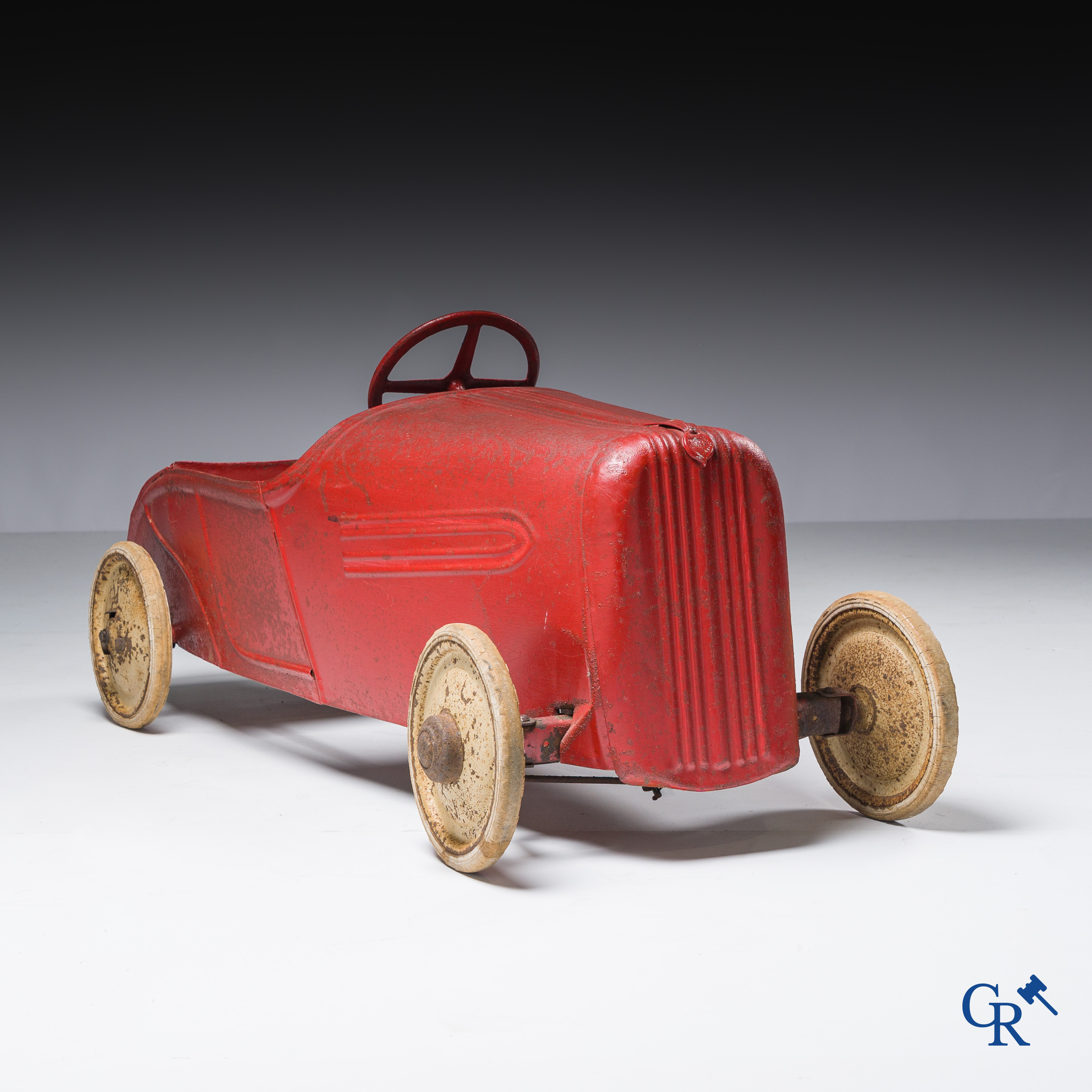 Torck, Deinze. Pedal car with white rubber tires and original emblem. Circa 1936.