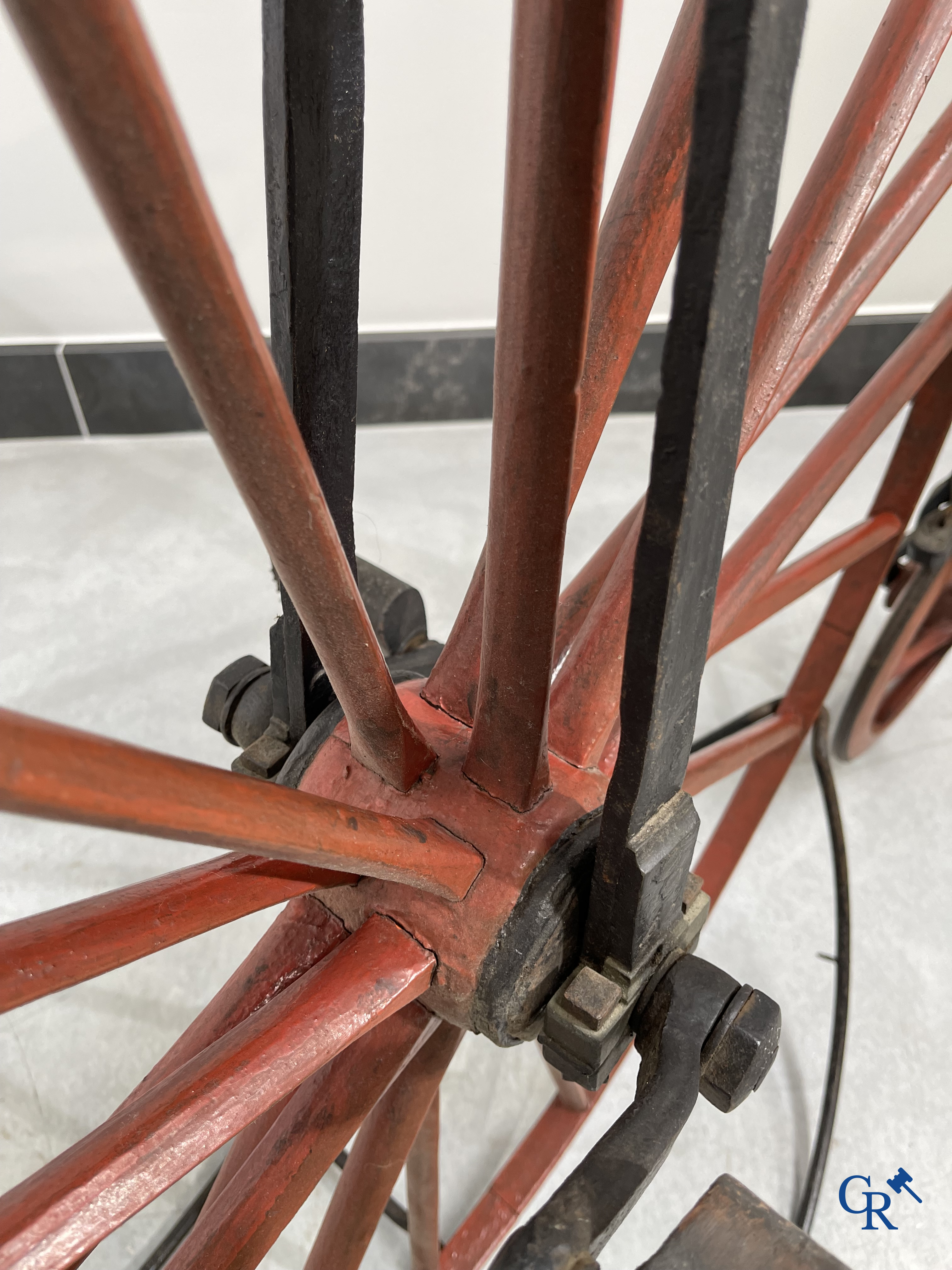 Penny-farthing with wooden spoked wheels on the original wrought iron upright. Circa 1880.