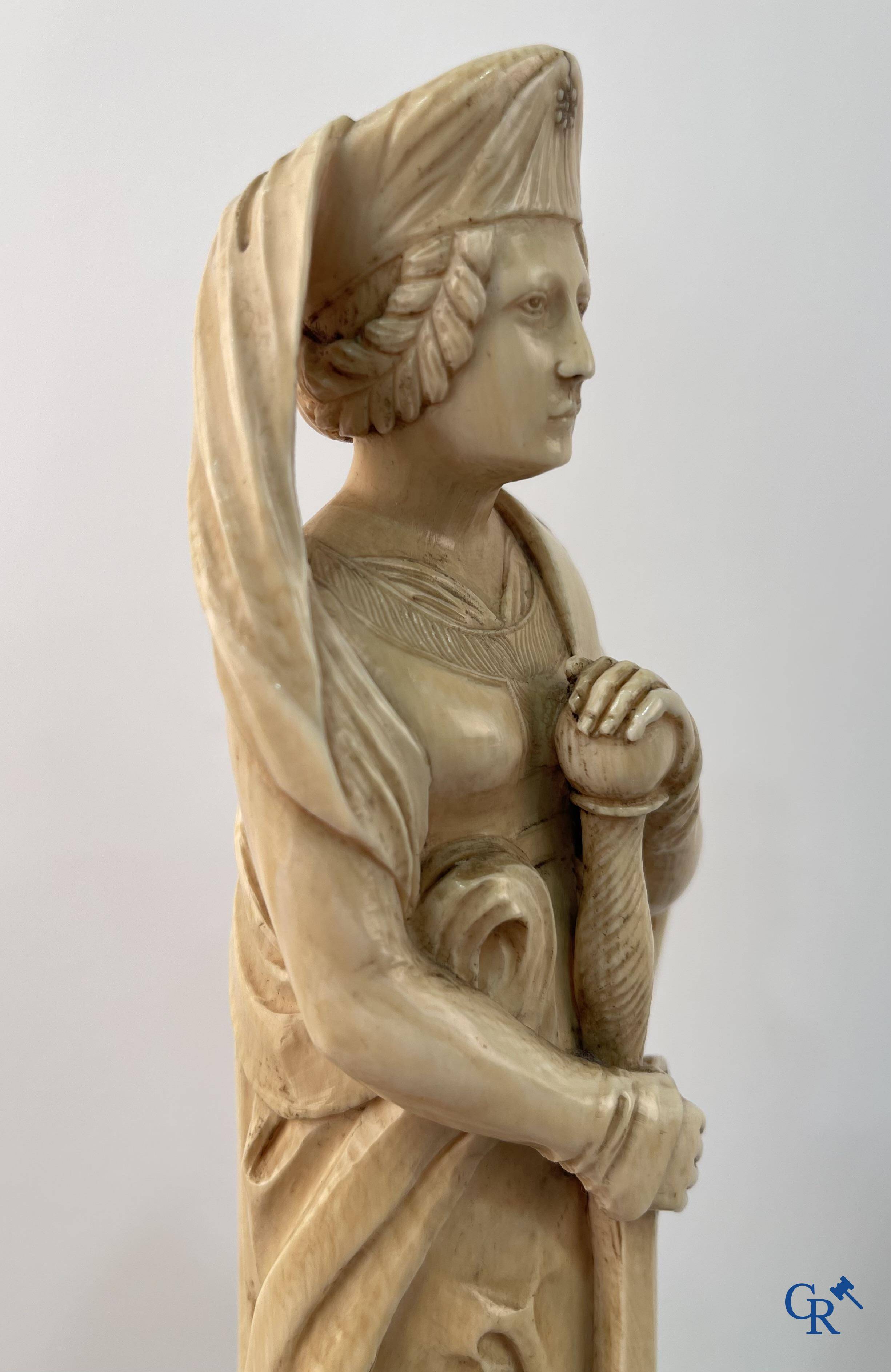 Dieppe, French work, early 19th century. Representation of Catherine of Alexandria in ivory on a pedestal.