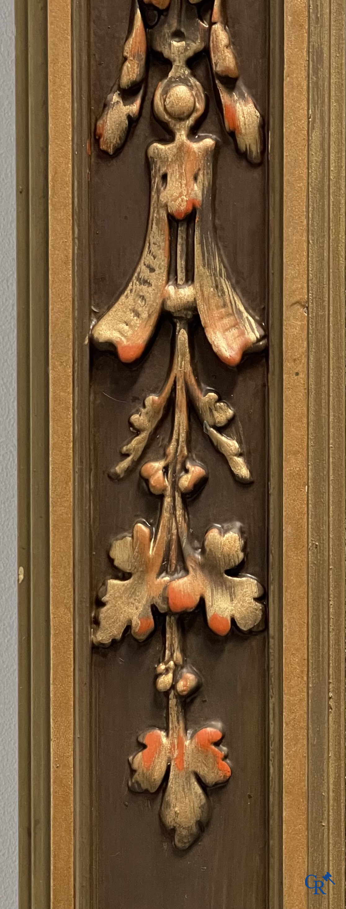 A large patinated fireplace mirror with a dragon. Around 1900.