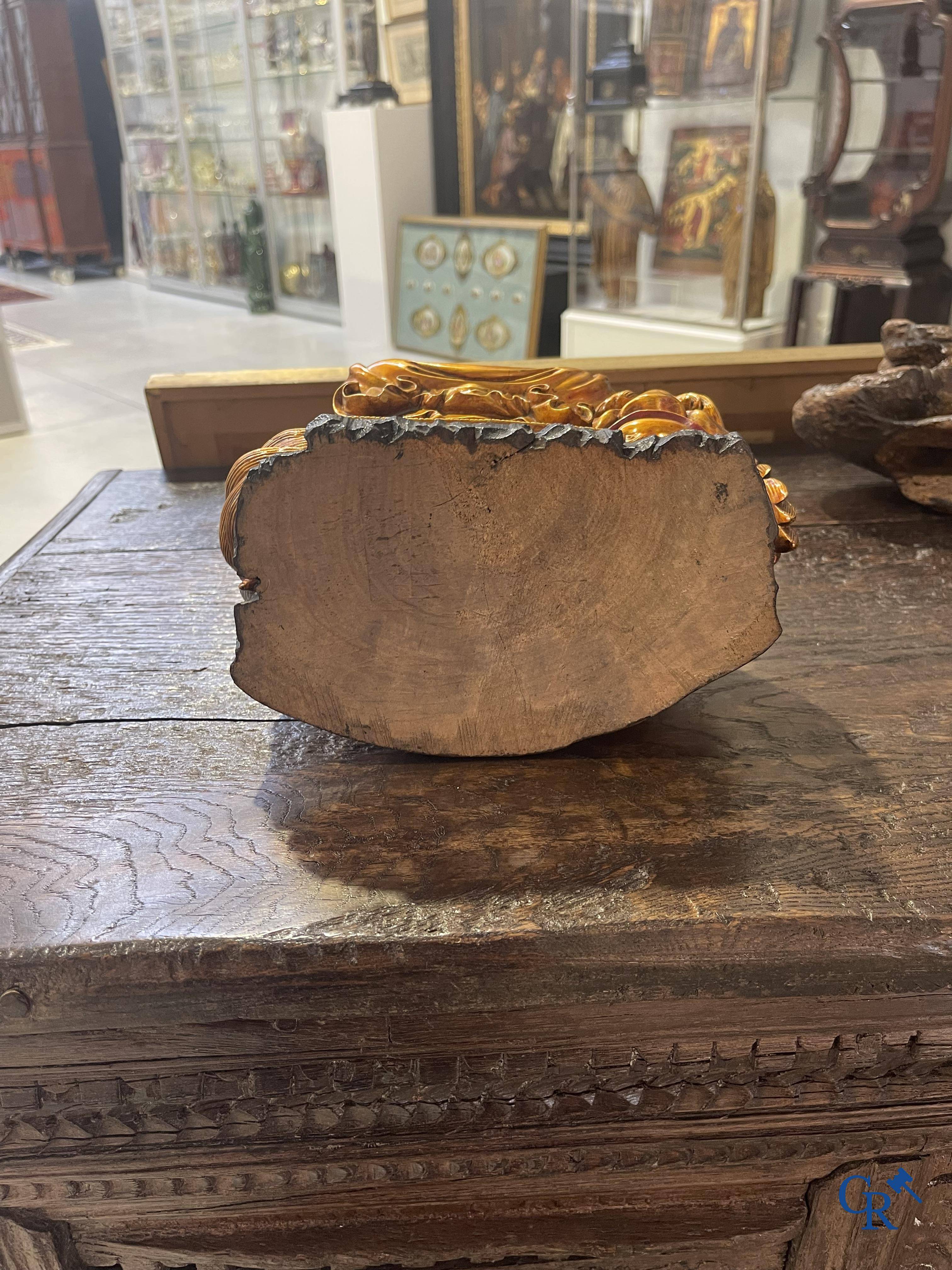 Asian Art: A Chinese sculpture of Vaishravana on a Buddhist lion in lacquered and gilded wood. 19th century.