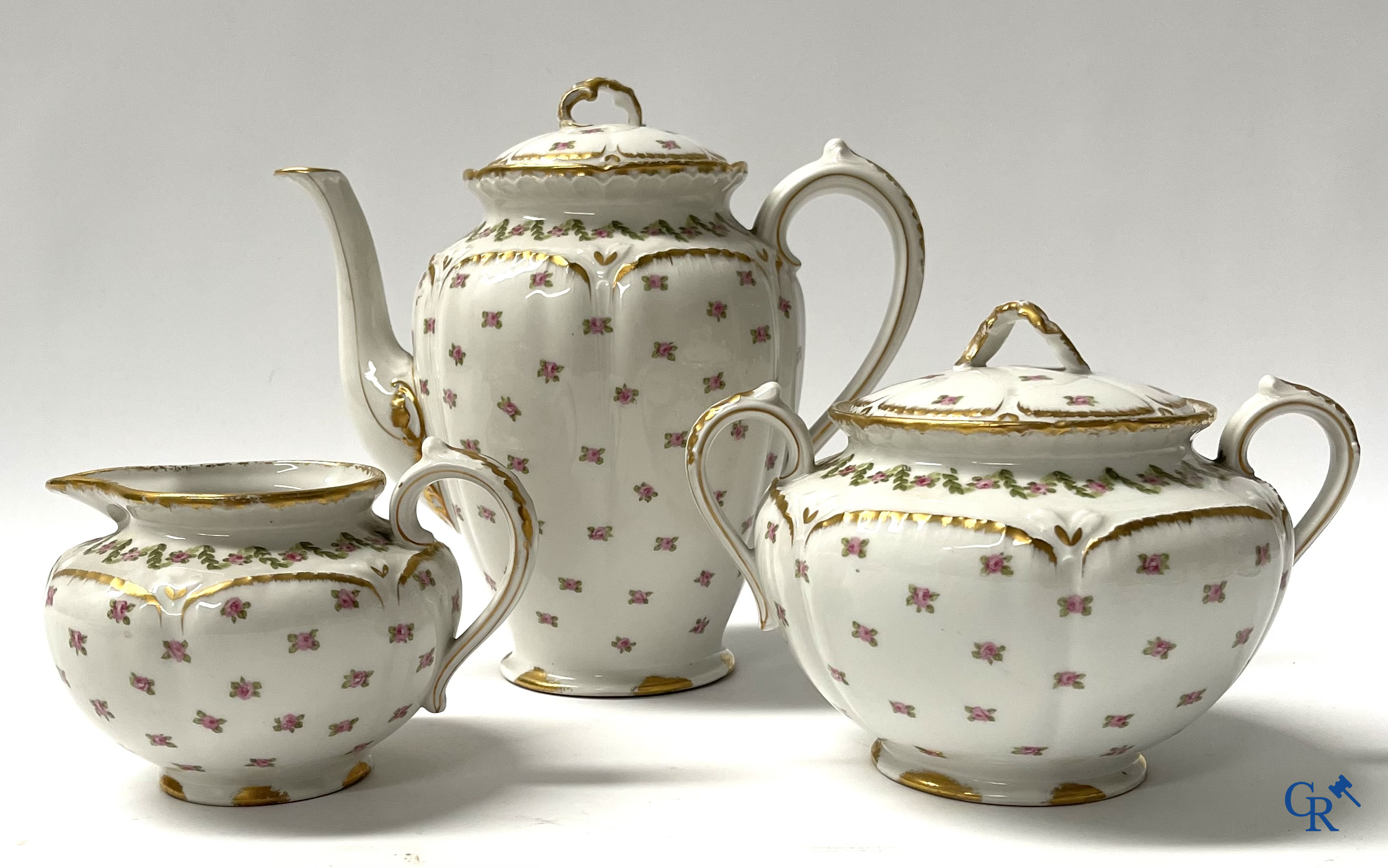 A coffee and tea set with 12 dessert plates in gilded and polychrome decorated French porcelain. Around 1900.