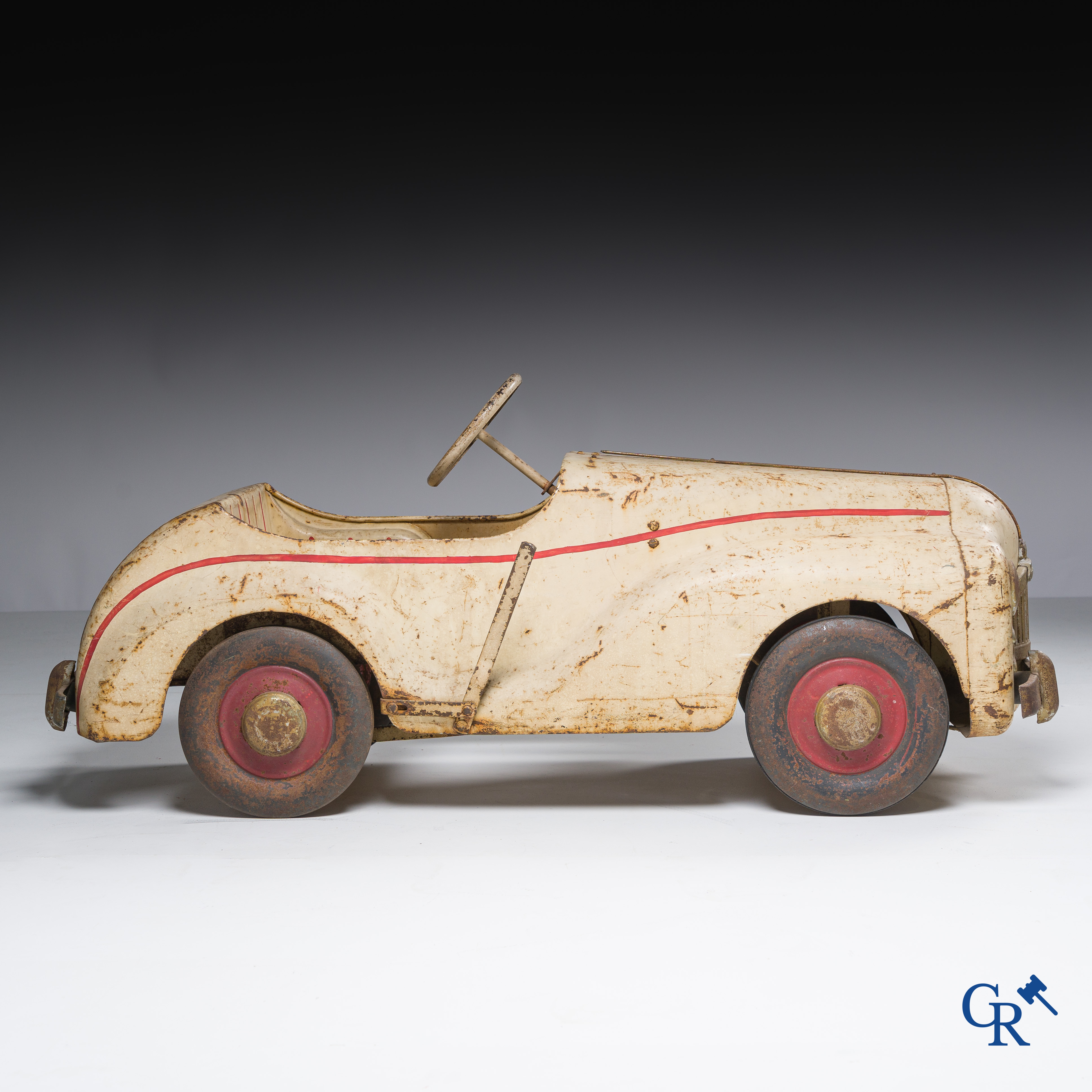 Tri-Ang. Metal pedal car in original condition. Circa 1950.