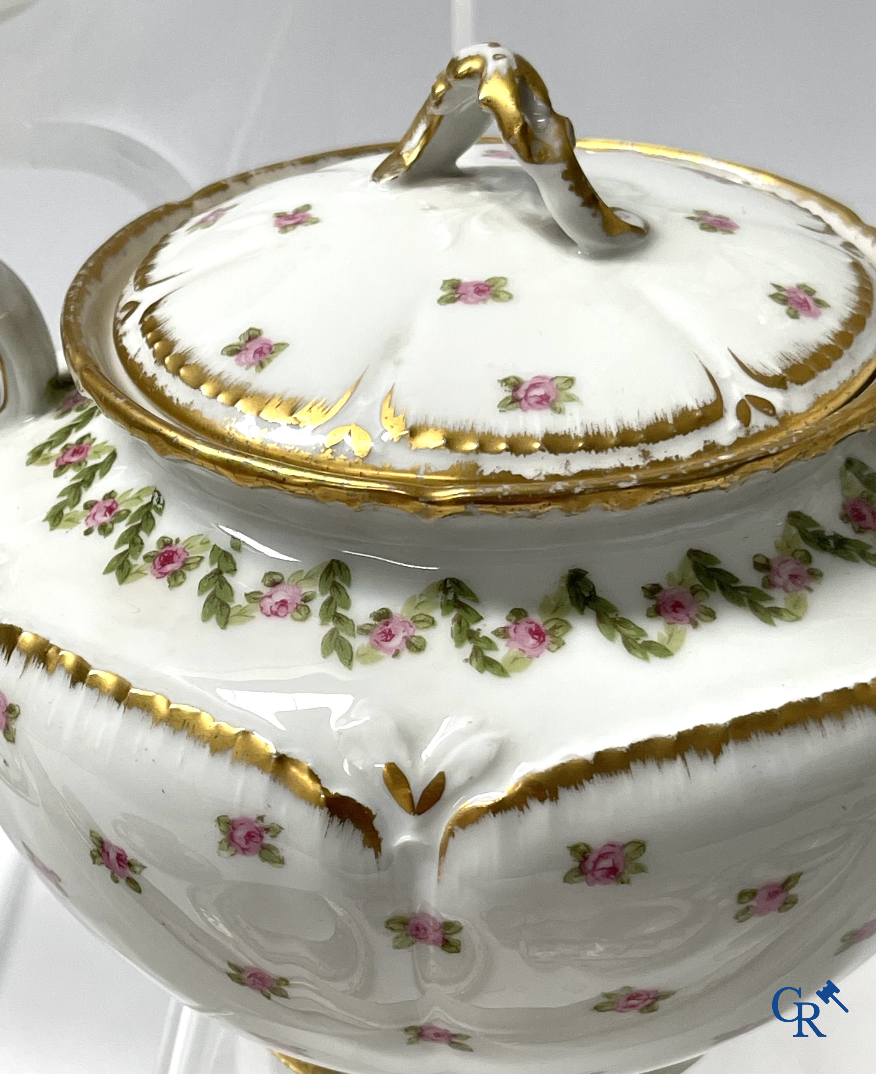 A coffee and tea set with 12 dessert plates in gilded and polychrome decorated French porcelain. Around 1900.