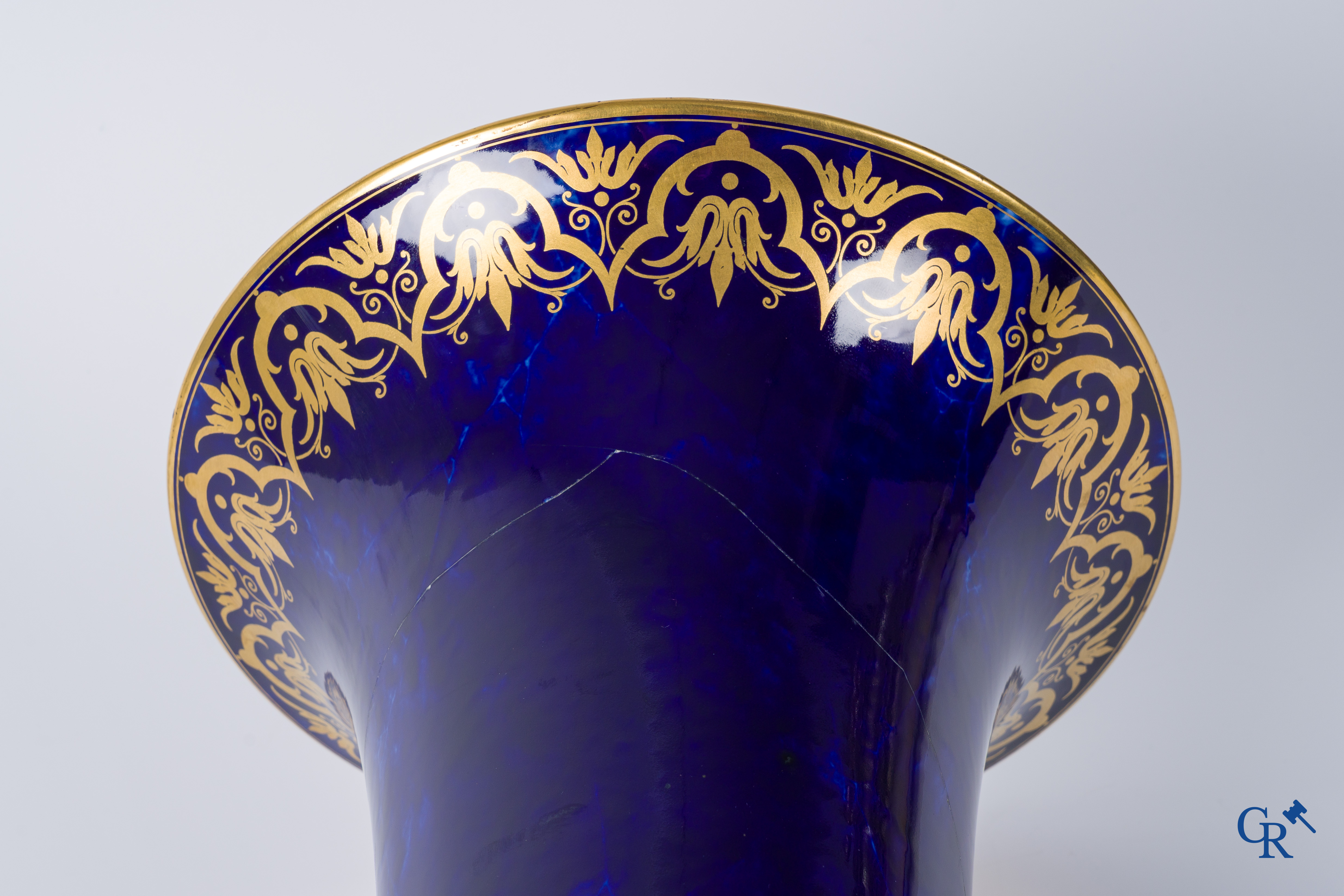 Manufacture Nationale de Sèvres. important vase with a gilded decor on a blue background colour.