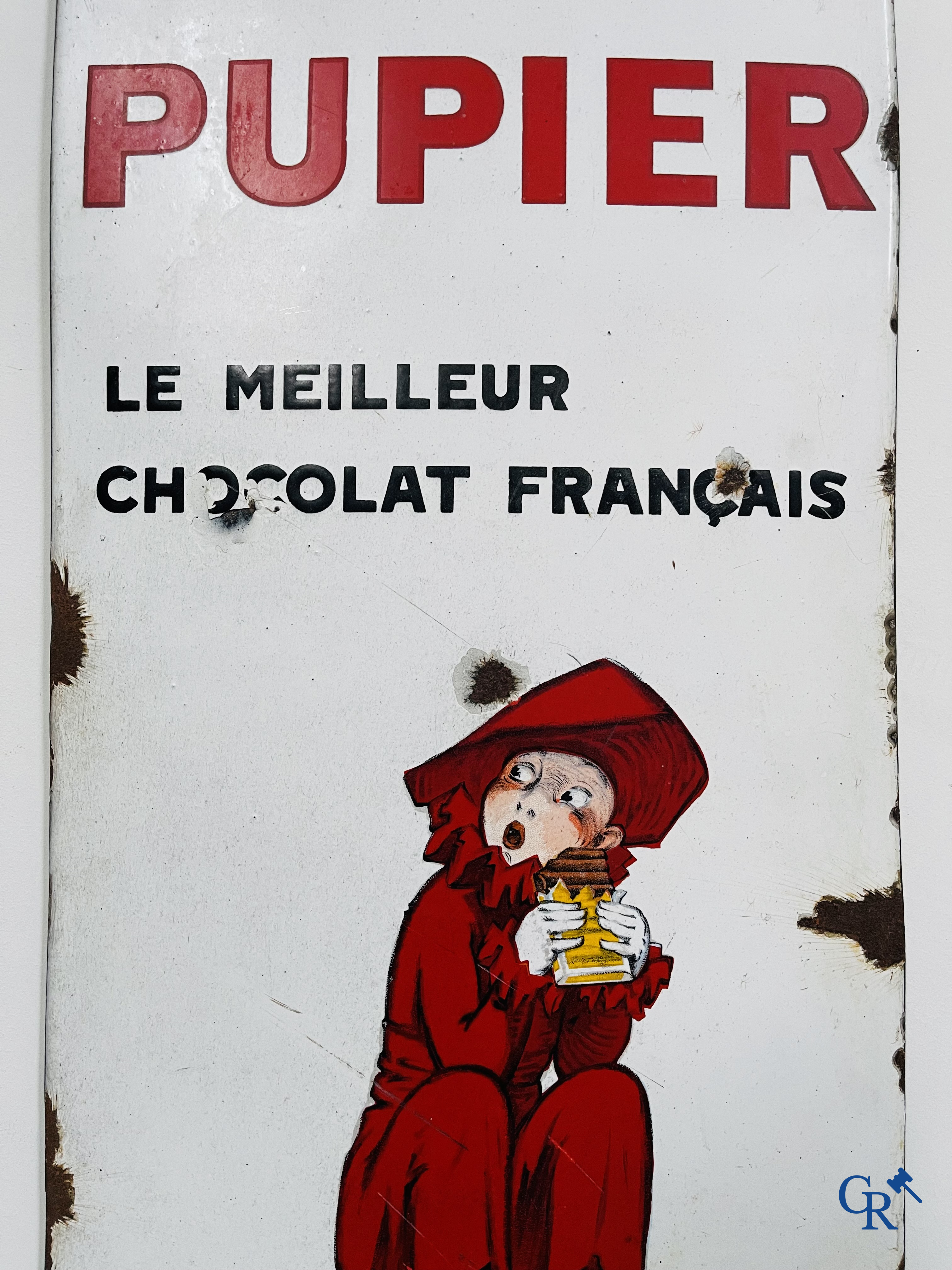 Chocolat Pupier, Enamel Advertising sign illustrated with the character designed by Jean D'Ylen. 1930's.