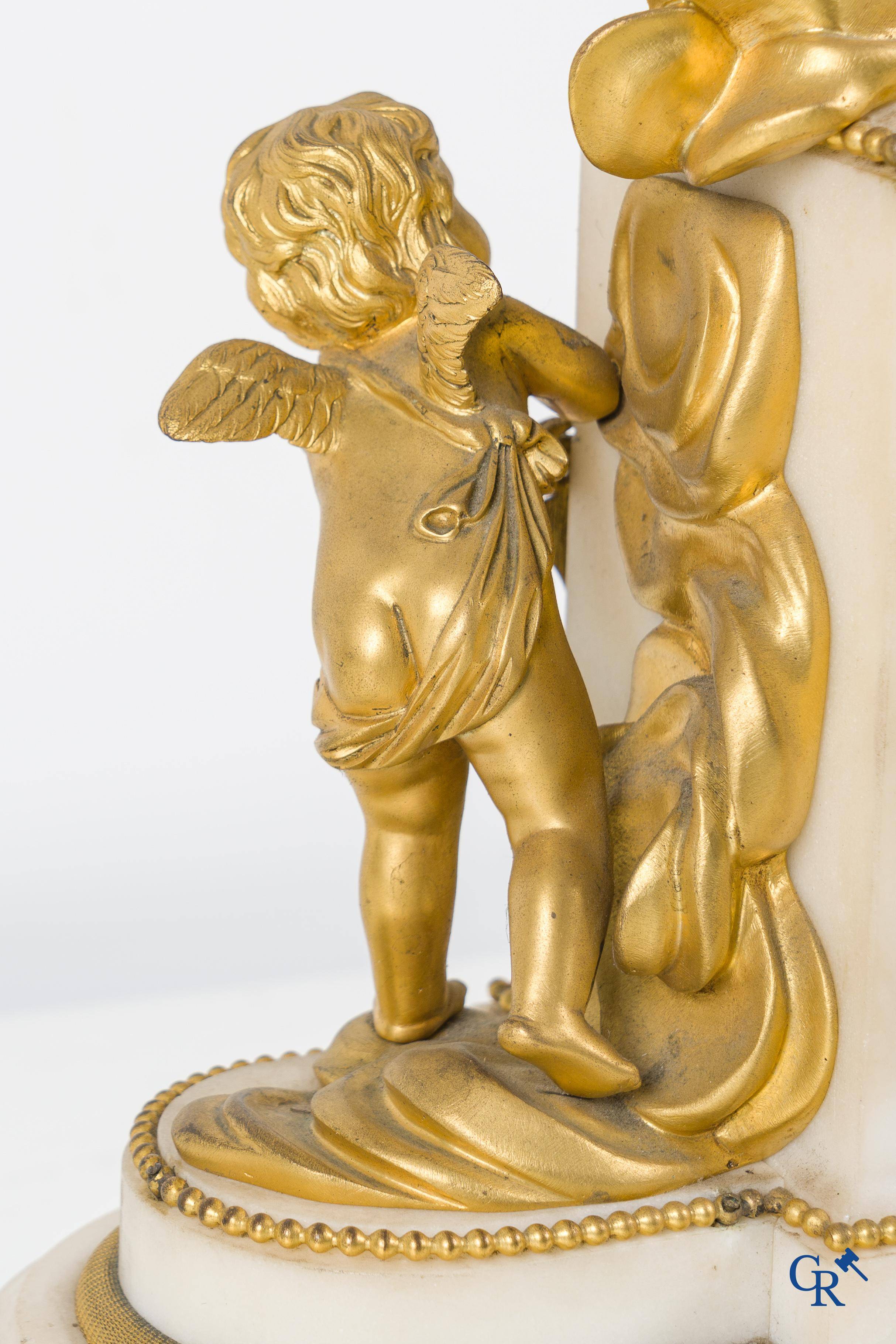 A finely chiseled and gilded LXVI-style clock in marble and bronze. circa 1880.