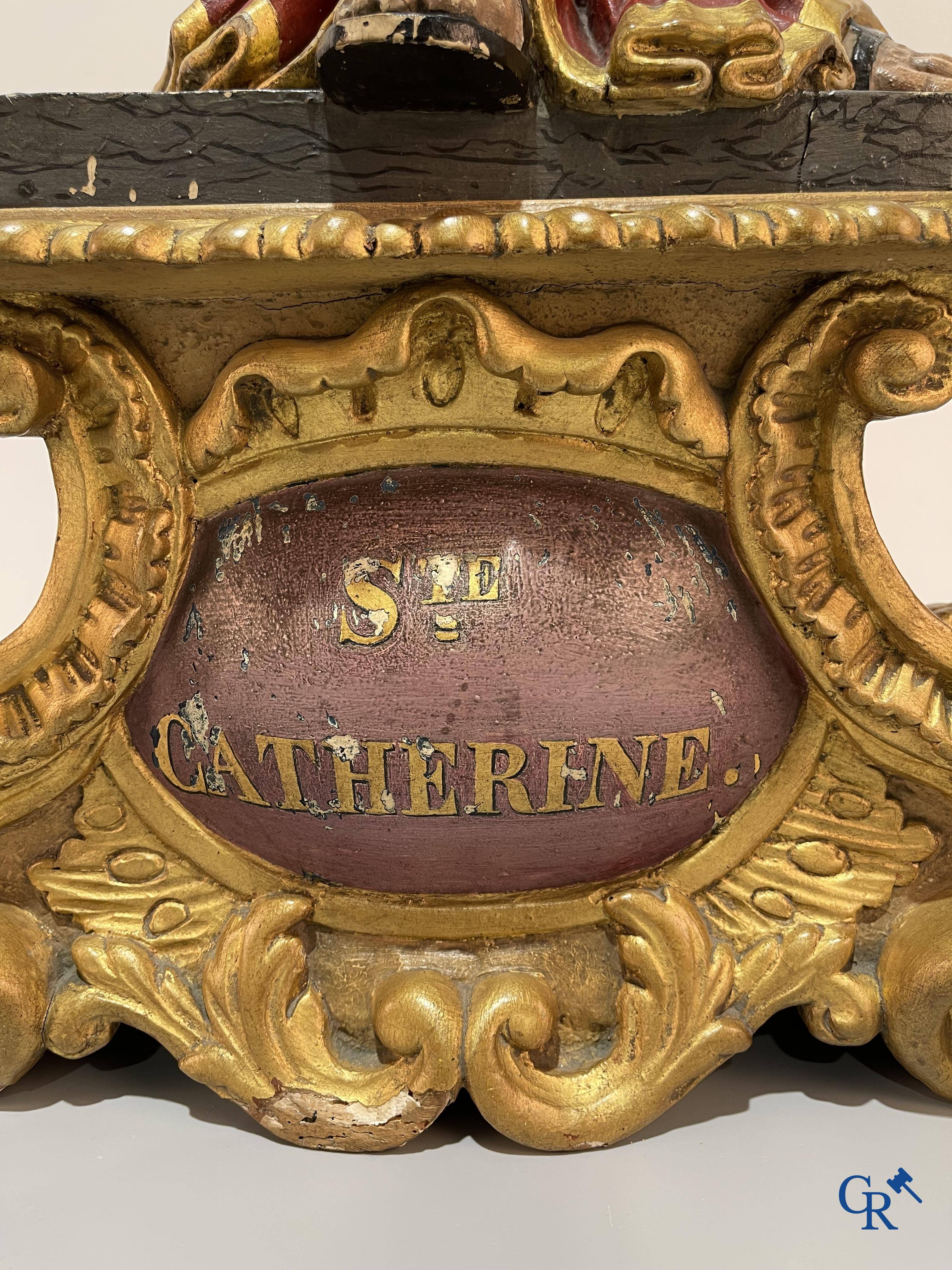 Religious objects, a finely carved and polychrome wooden statue of Saint Catherine in Baroque style. 18th century.