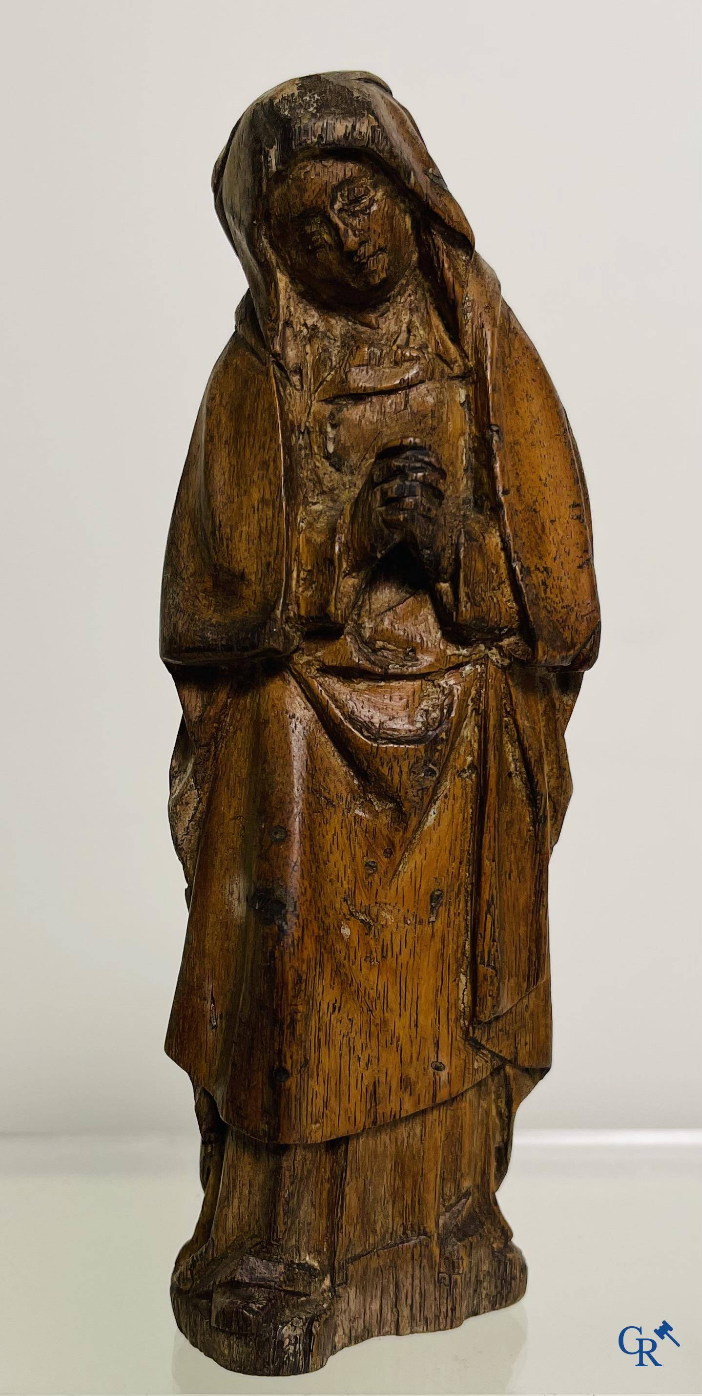 2 religious fragments in palm wood and lime wood. 16th-17th century.
