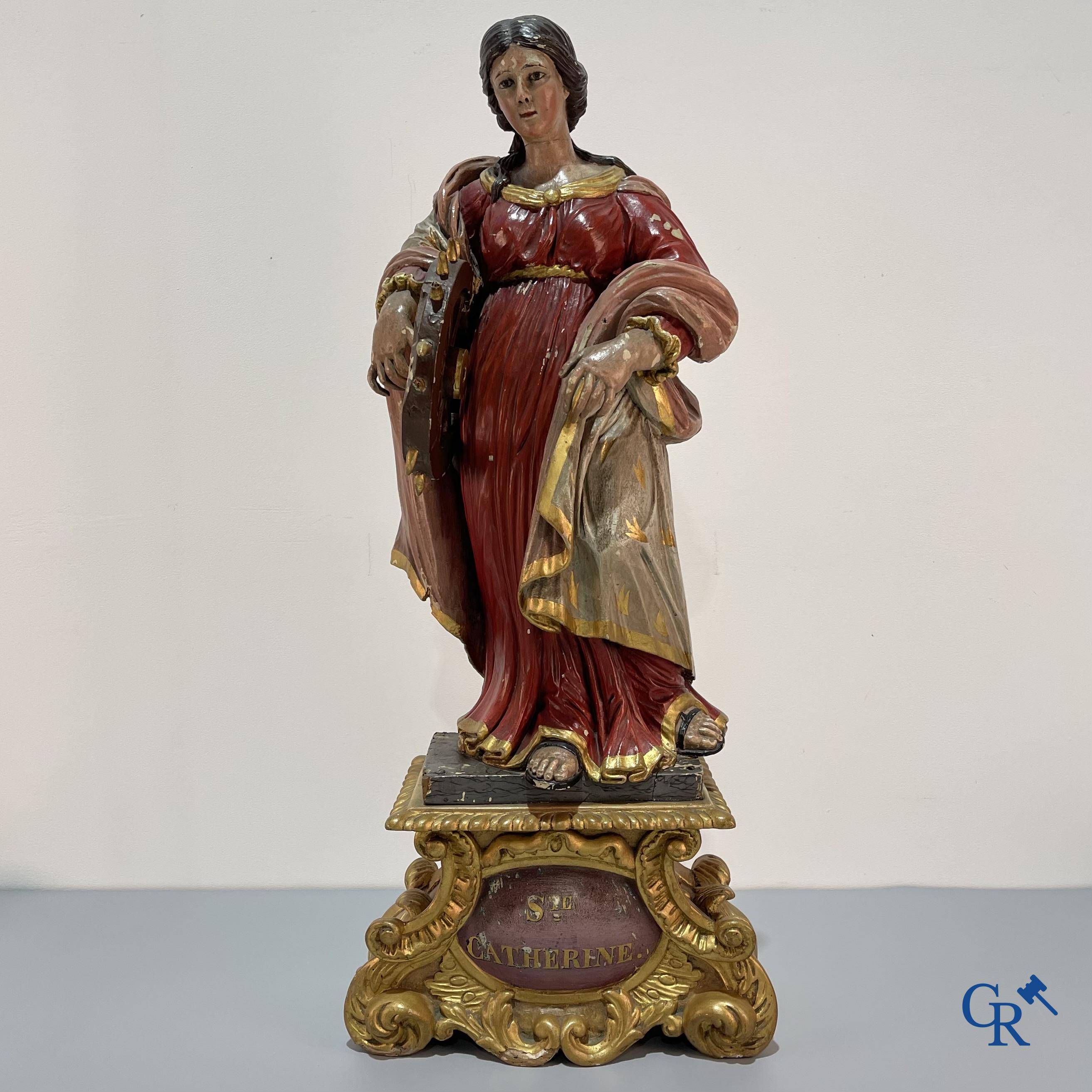 Religious objects, a finely carved and polychrome wooden statue of Saint Catherine in Baroque style. 18th century.