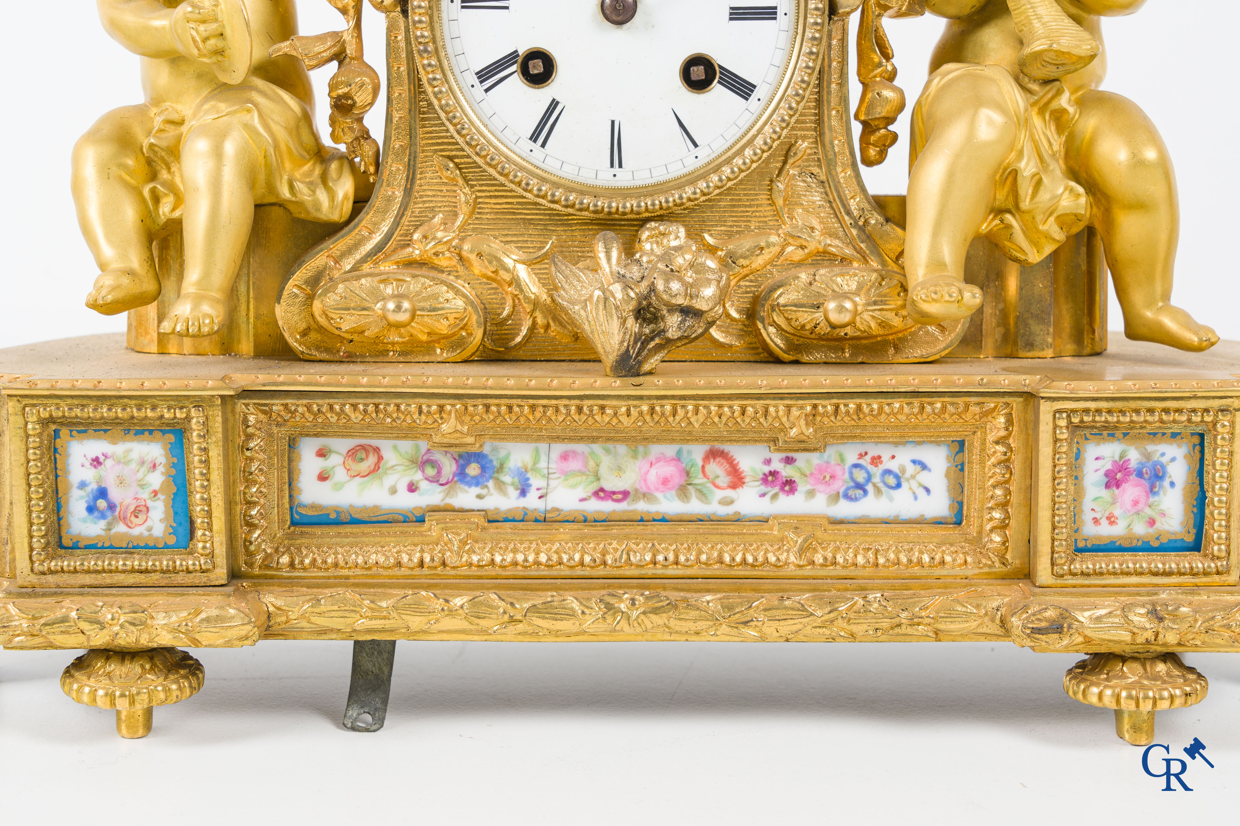 A 3-piece gilded bronze fireplace clockset with Sèvres porcelain.