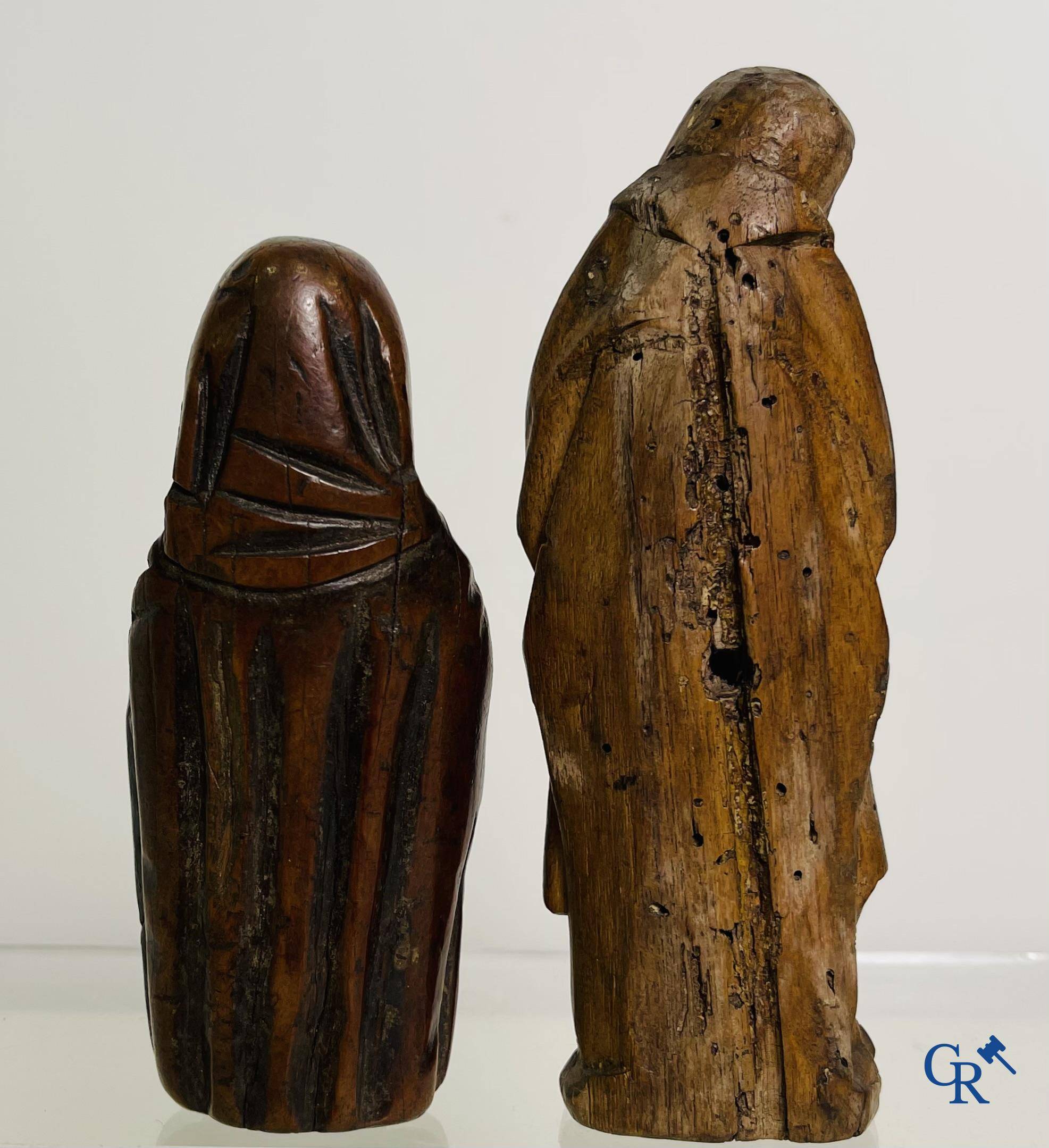 2 religious fragments in palm wood and lime wood. 16th-17th century.