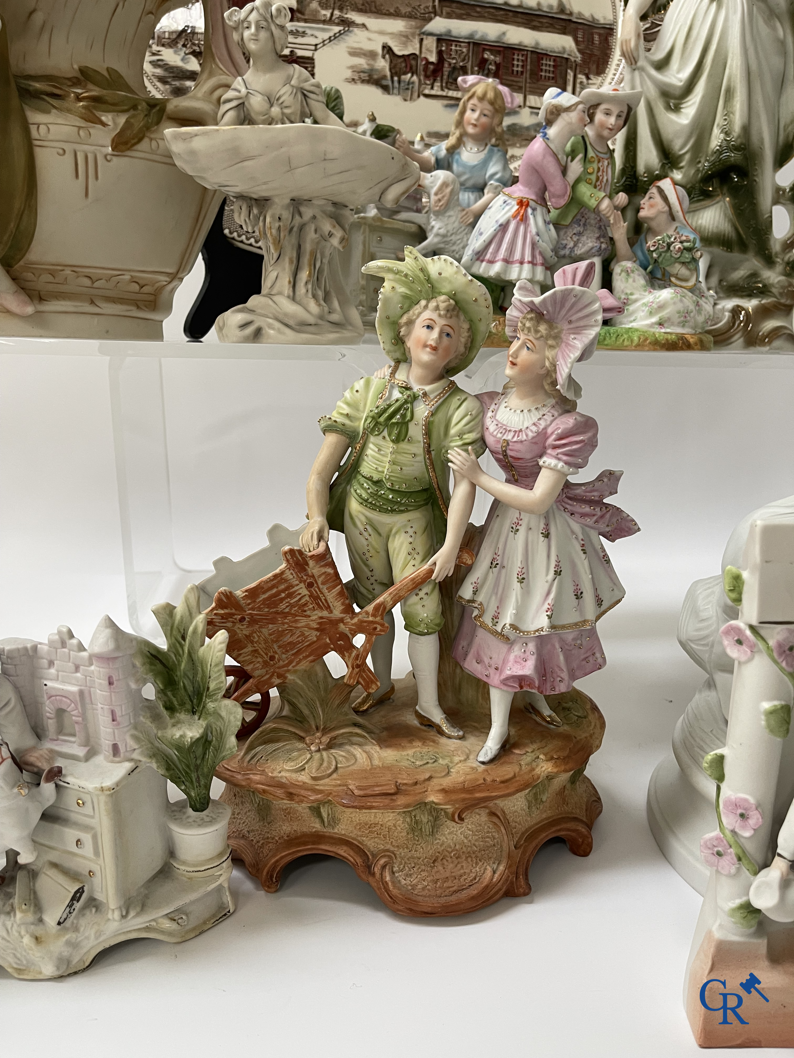 A large lot of brocante including Royal Dux, Biscuit statues, porcelain, globes, spelter statues, table lamp, chandelier etc.