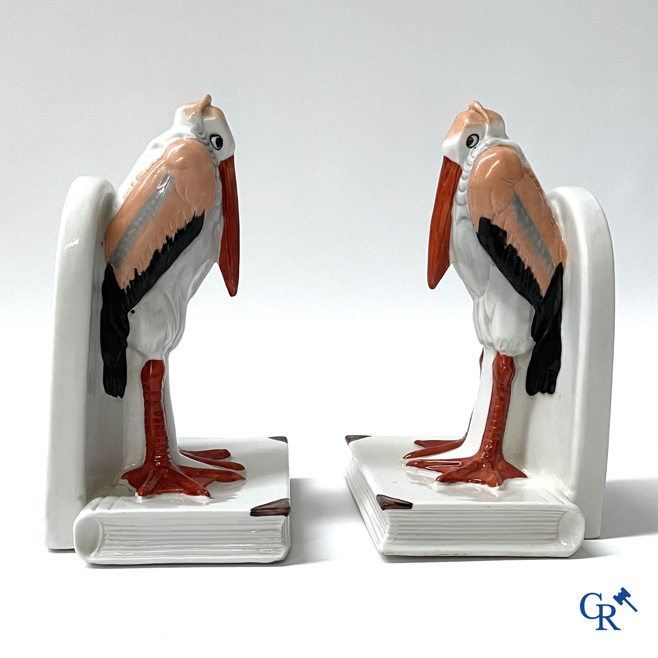 Art Deco, a pair of bookends in polychrome porcelain with a typical Art Deco representation of marabou.