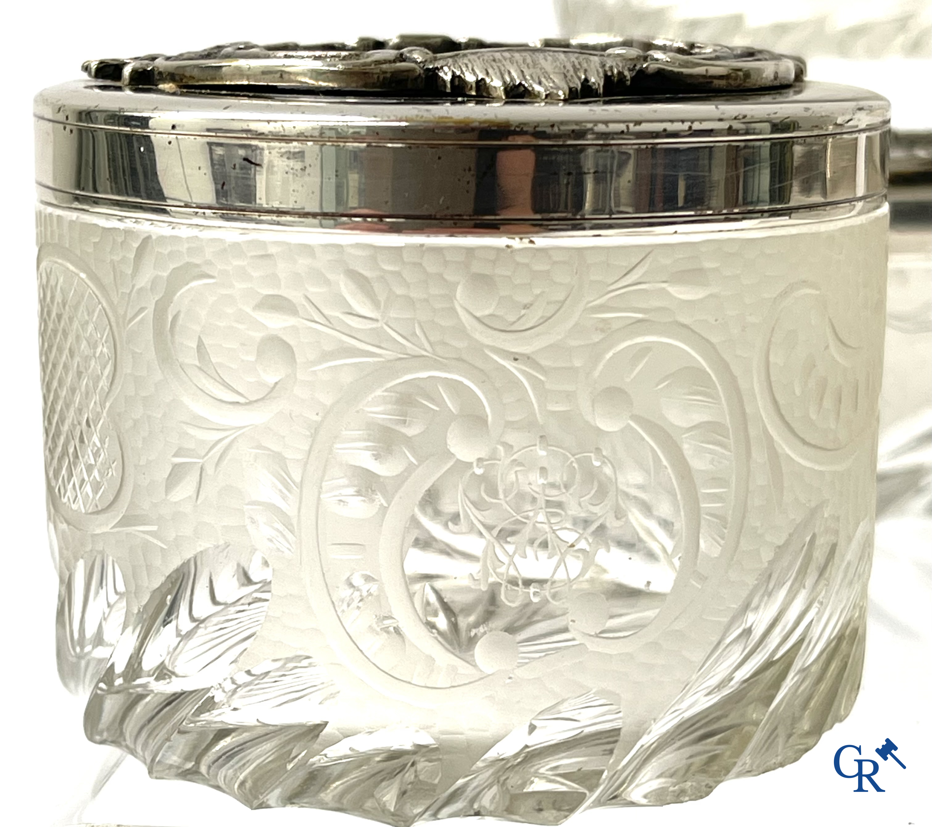 A seven-piece toilet set in silver-plated metal, finely cut crystal and enamelled plaques.