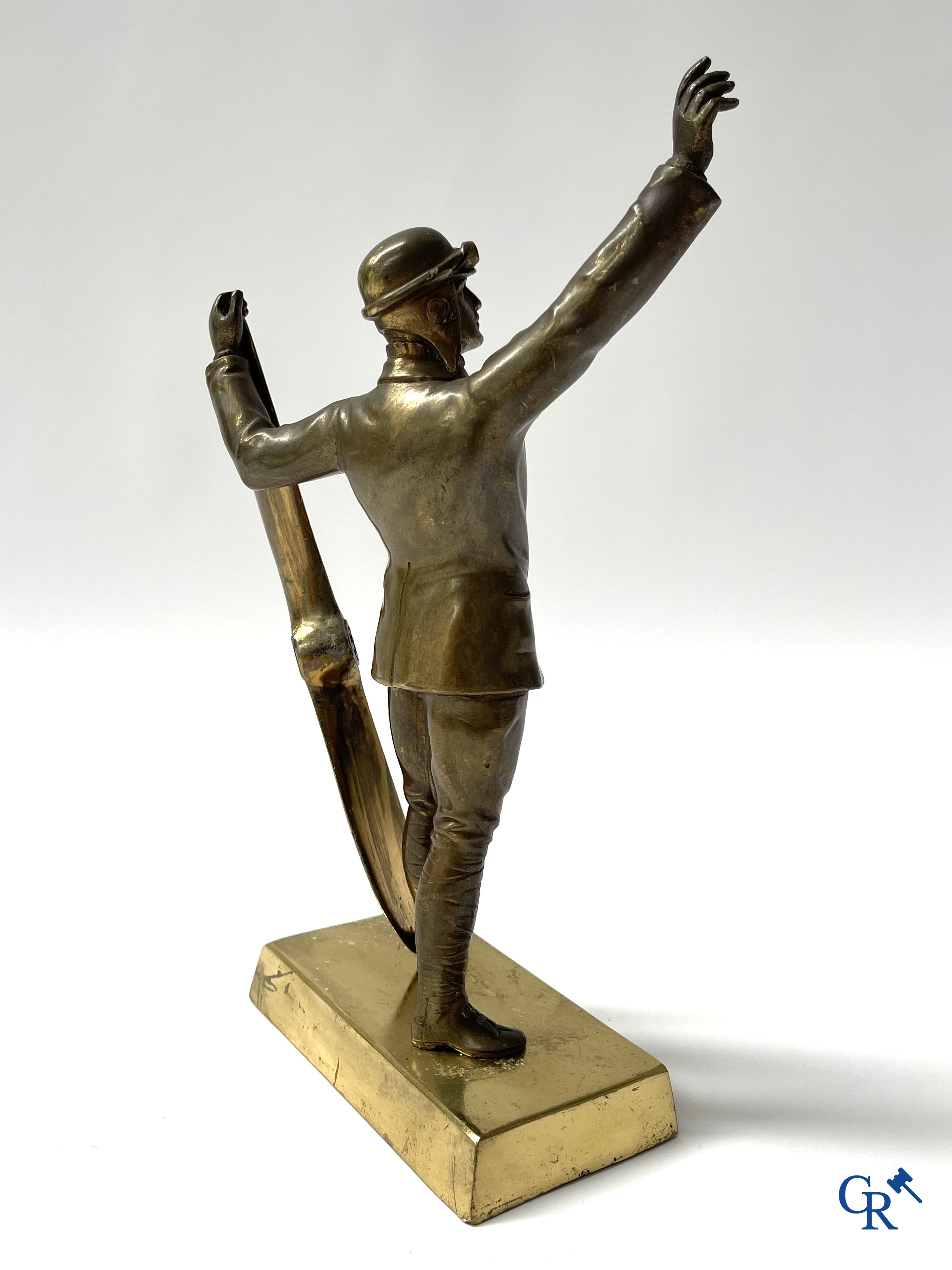 Aeronautics, a bronze representation of an aircraft pilot with propeller. Around 1930.
