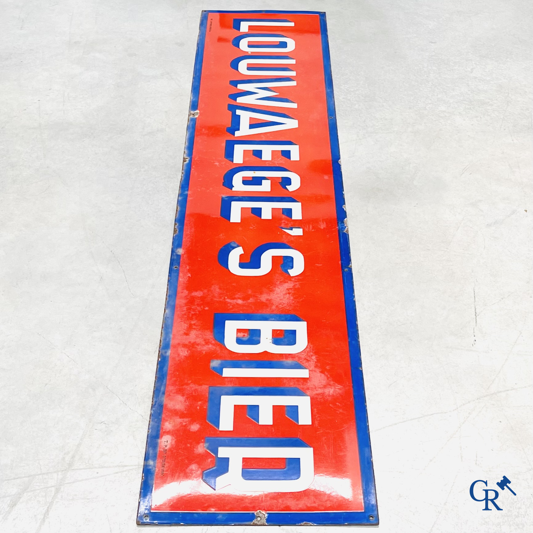 A large enamel advertising sign for Louwaege's beer. Enamel Koekelberg. T.P. Bruxelles 1950.