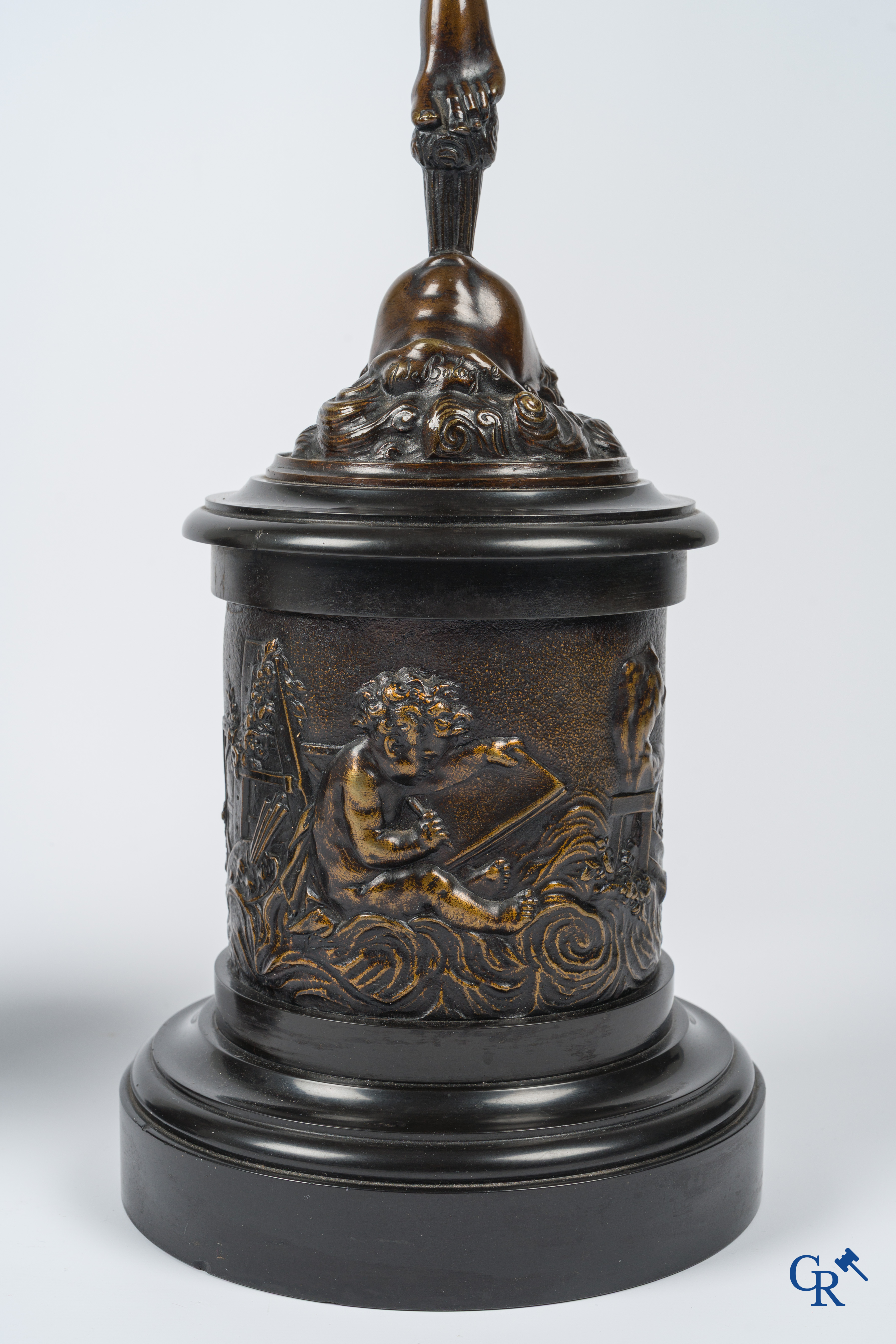 A pair of imposing bronze statues in the antique style after a model by Jean De Bologne.