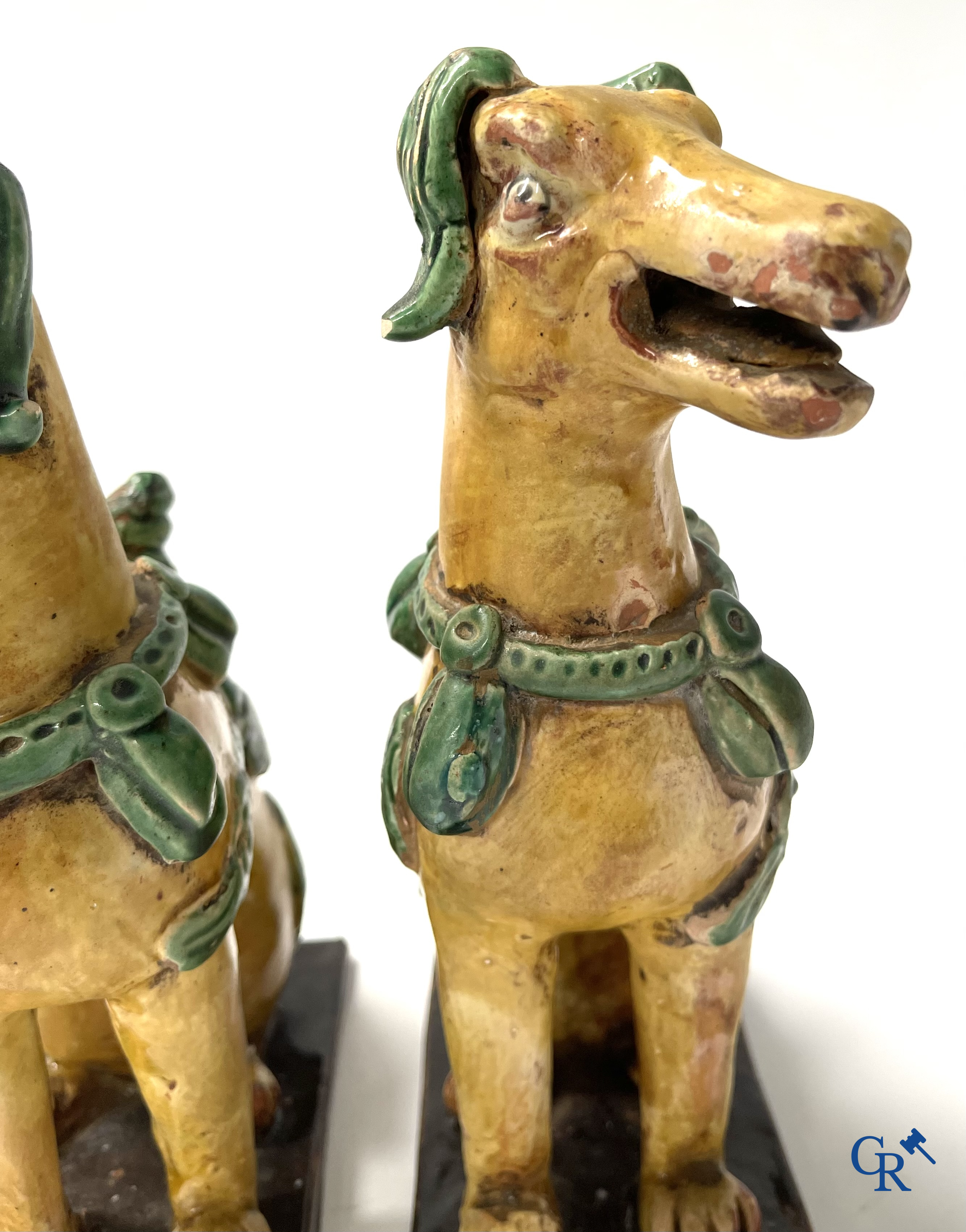 Asian Art, Chine. A pair of seated enamelled terra cotta dogs.