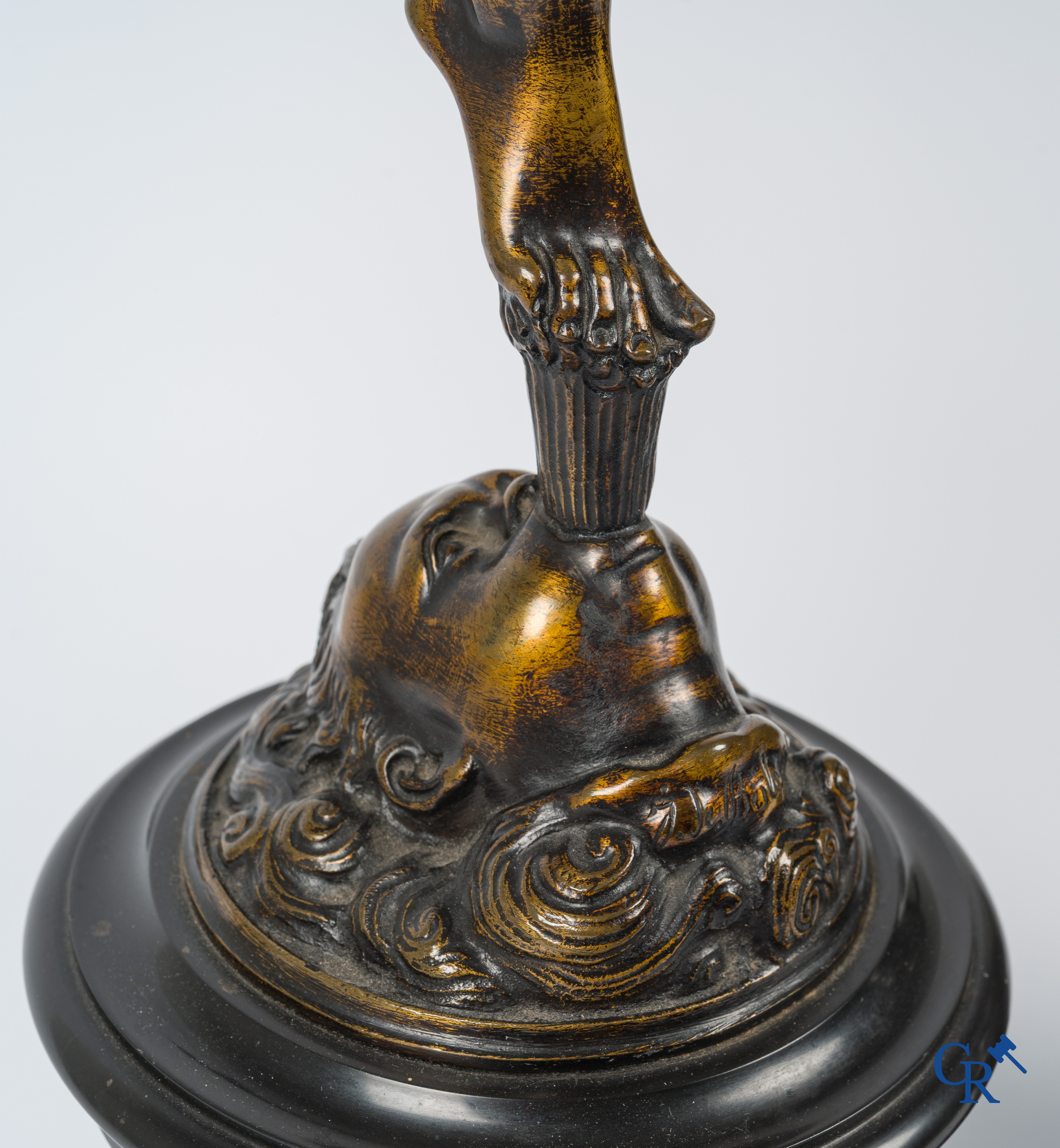 A pair of imposing bronze statues in the antique style after a model by Jean De Bologne.