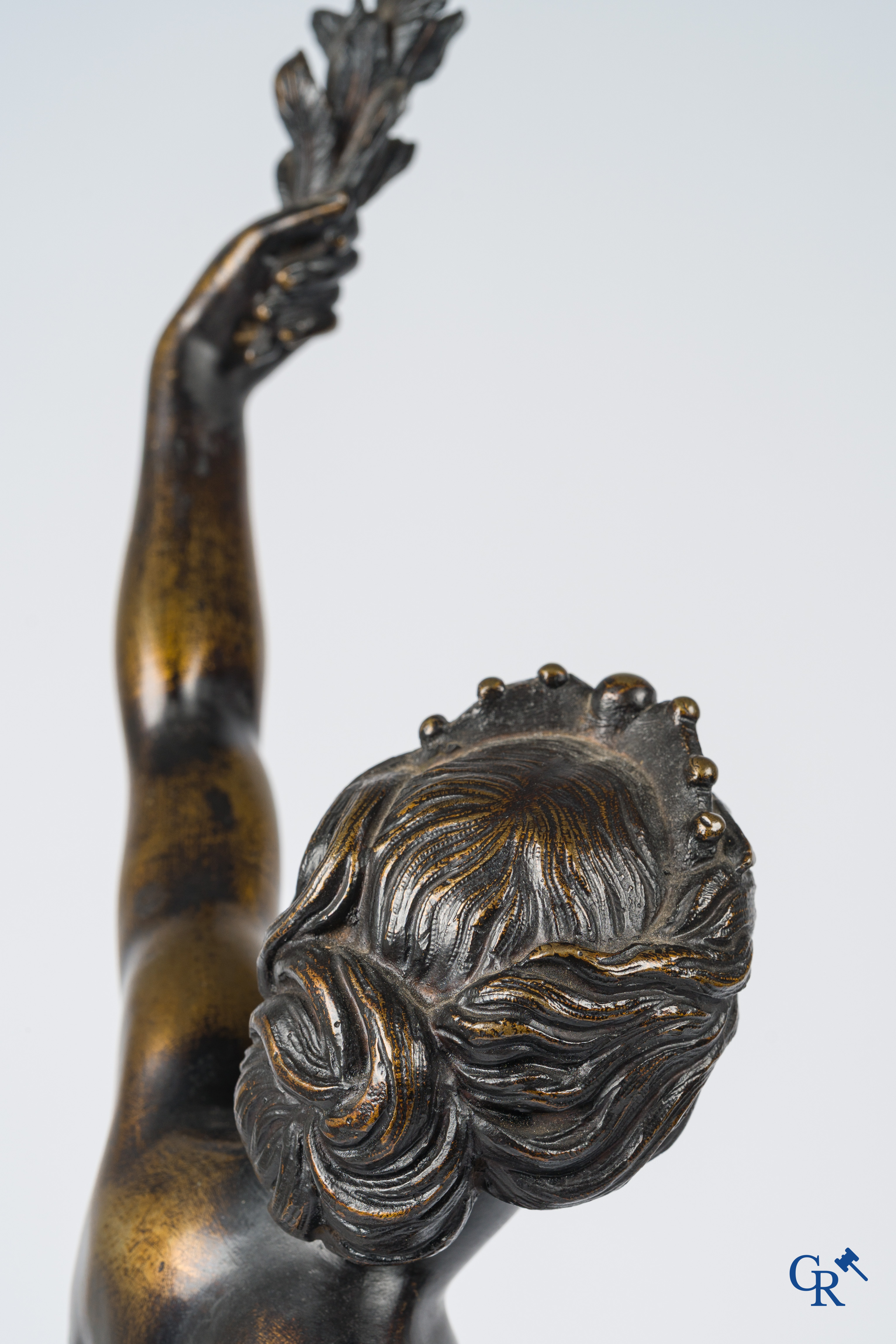 A pair of imposing bronze statues in the antique style after a model by Jean De Bologne.