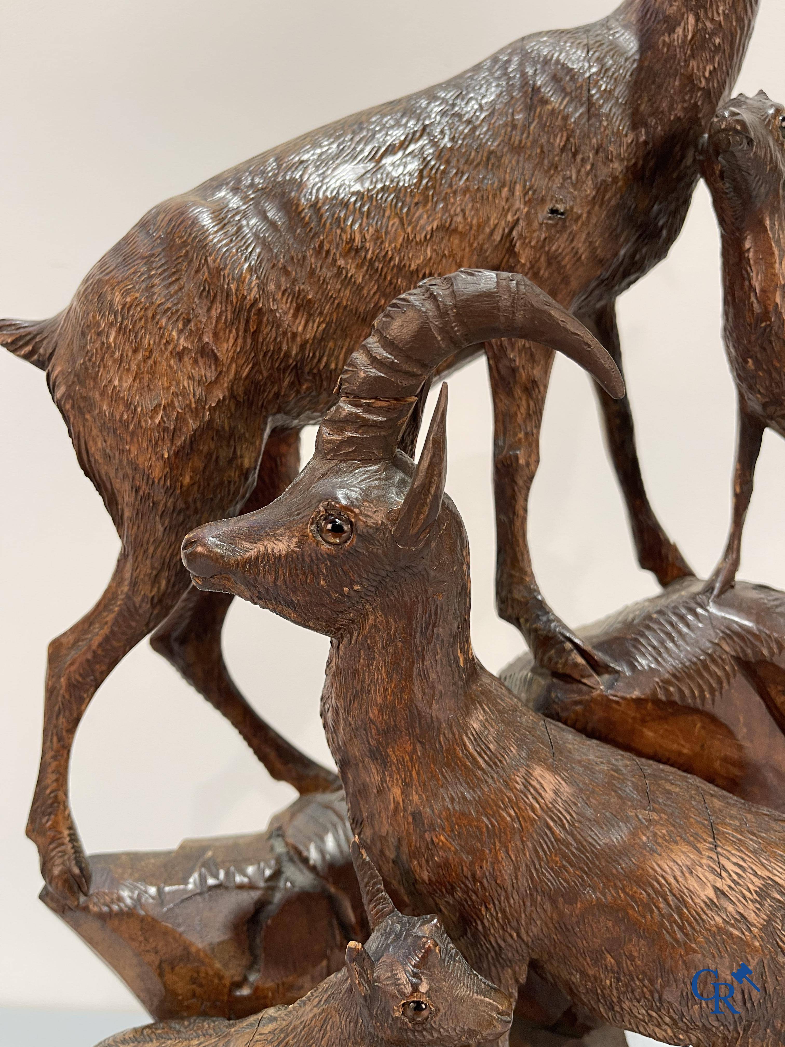 A Black Forest wood sculpture with capricorns, Germany circa 1900.