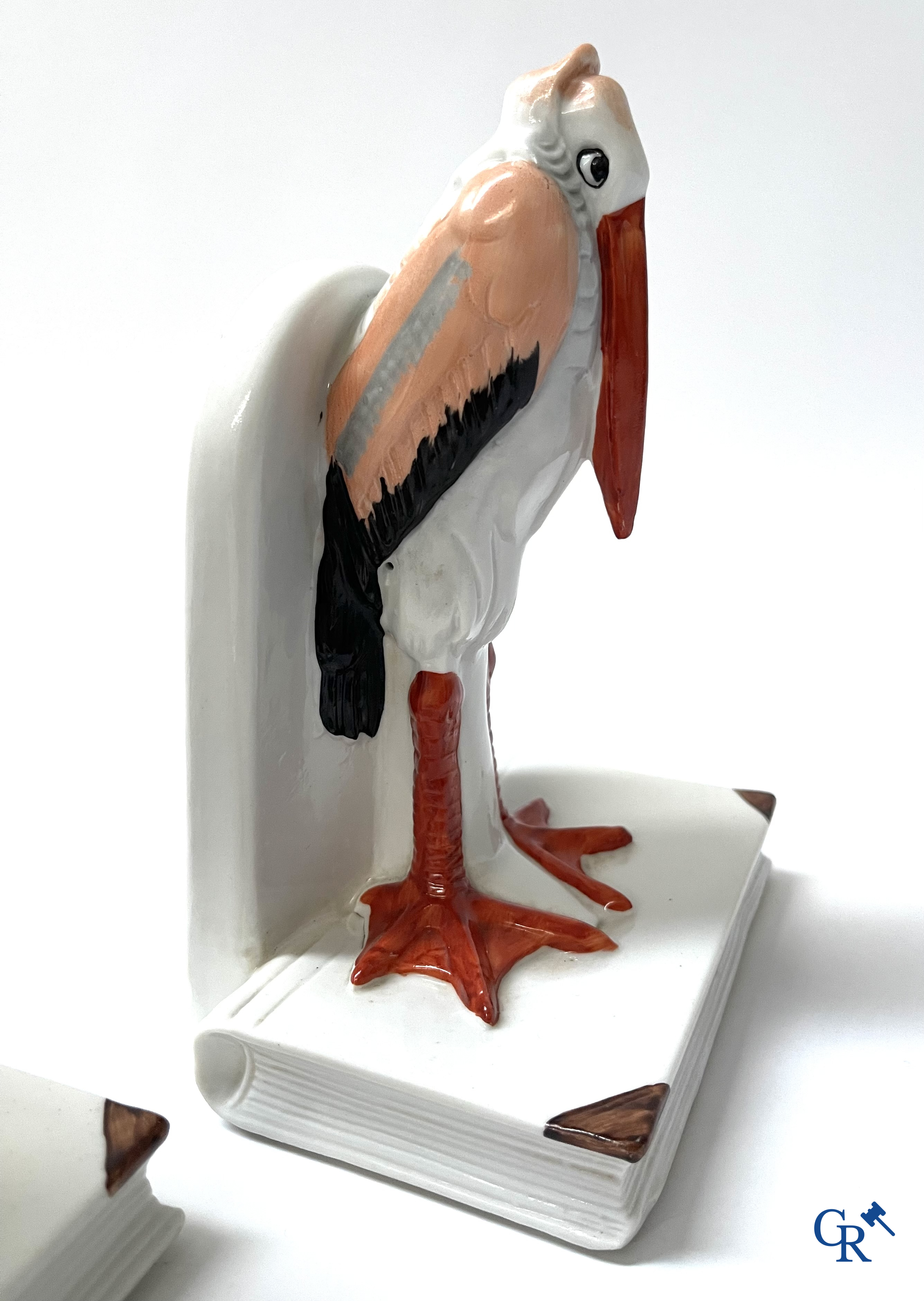 Art Deco, a pair of bookends in polychrome porcelain with a typical Art Deco representation of marabou.