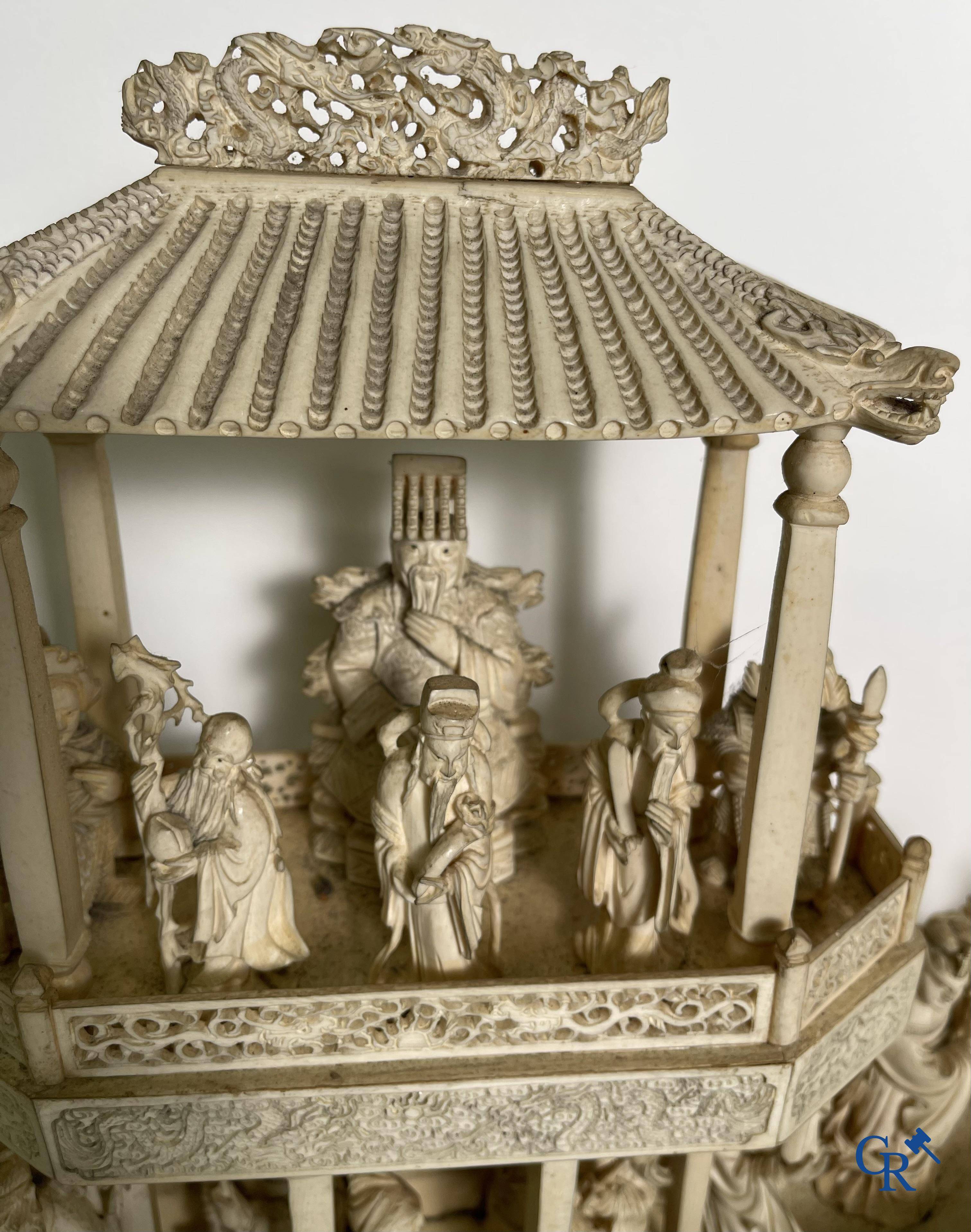 Asian Art: A large Chinese ivory dragon boat on a wooden pedestal. 19th century.