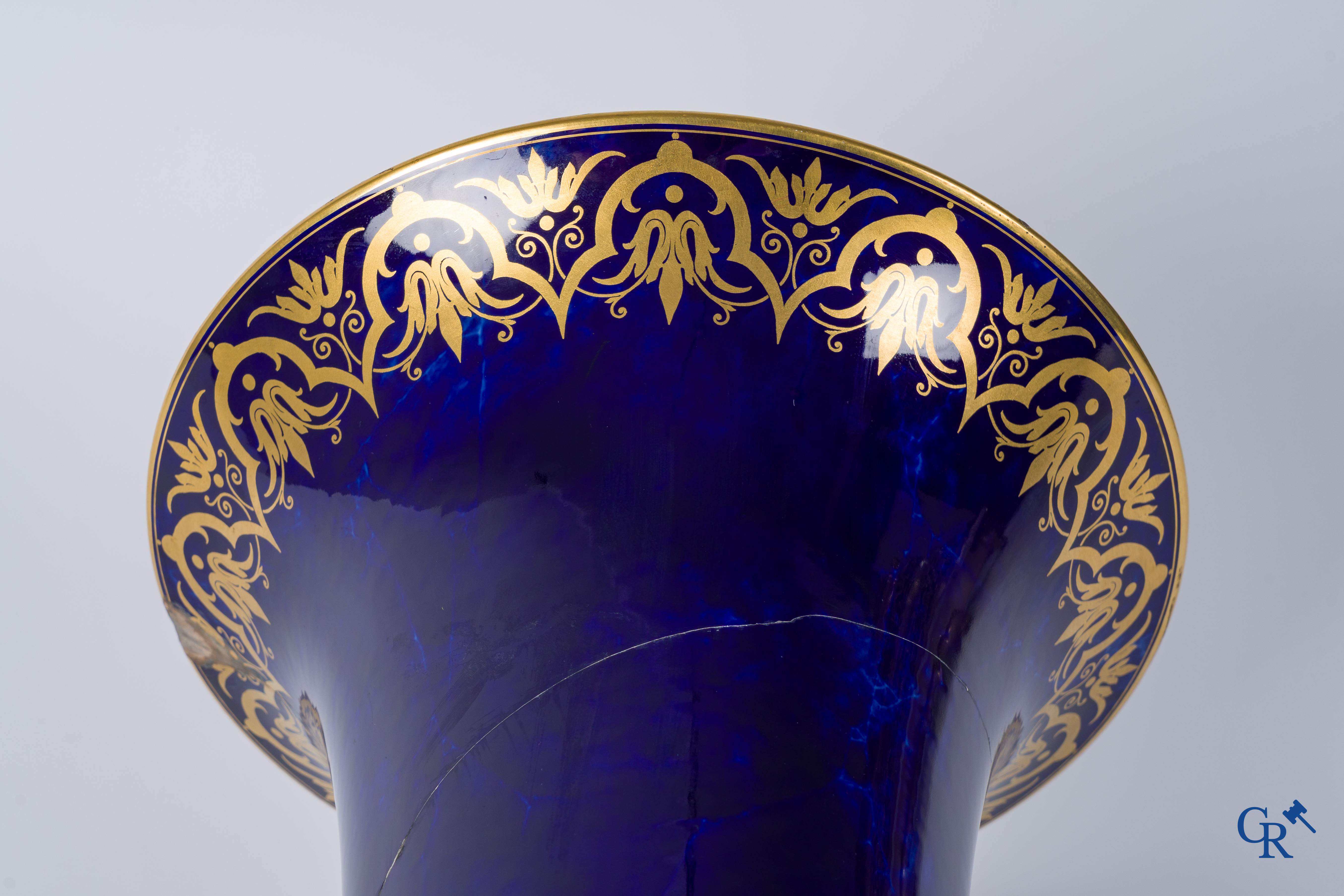 Manufacture Nationale de Sèvres. important vase with a gilded decor on a blue background colour.