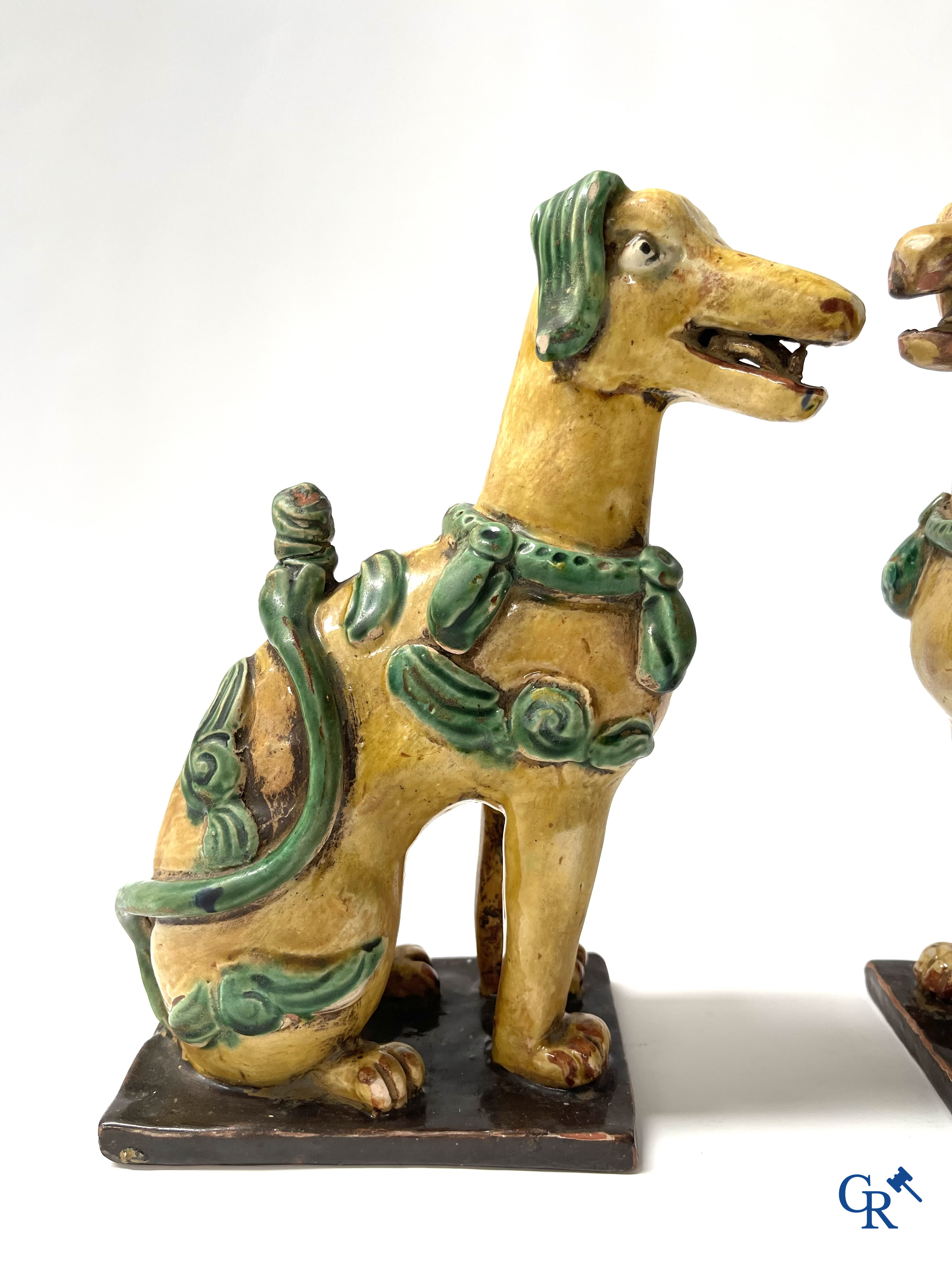 Asian Art, Chine. A pair of seated enamelled terra cotta dogs.