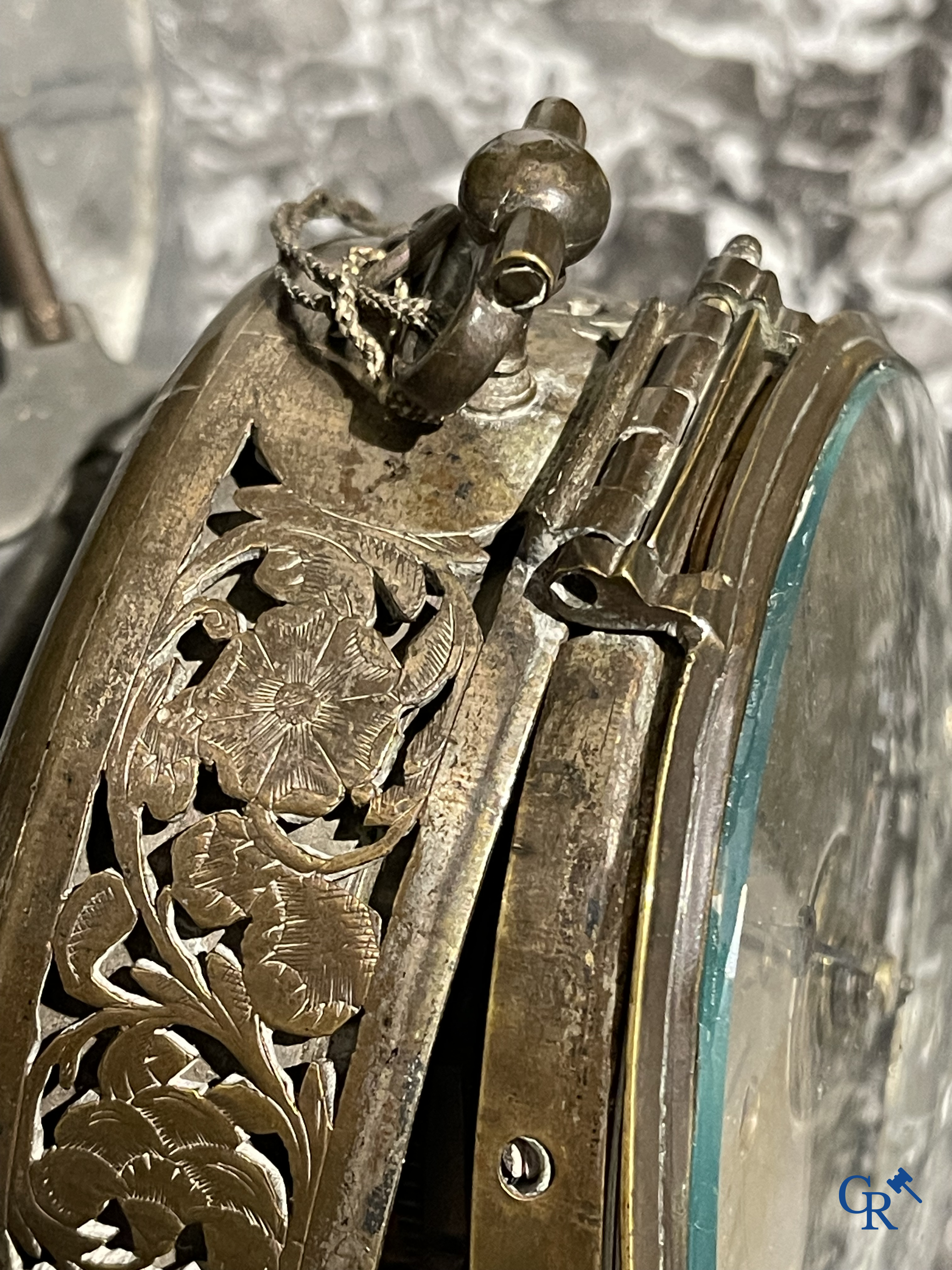 Clocks and watches. Montre de carosse. Large carriage watch with engraved and perforated case. France 17th century.