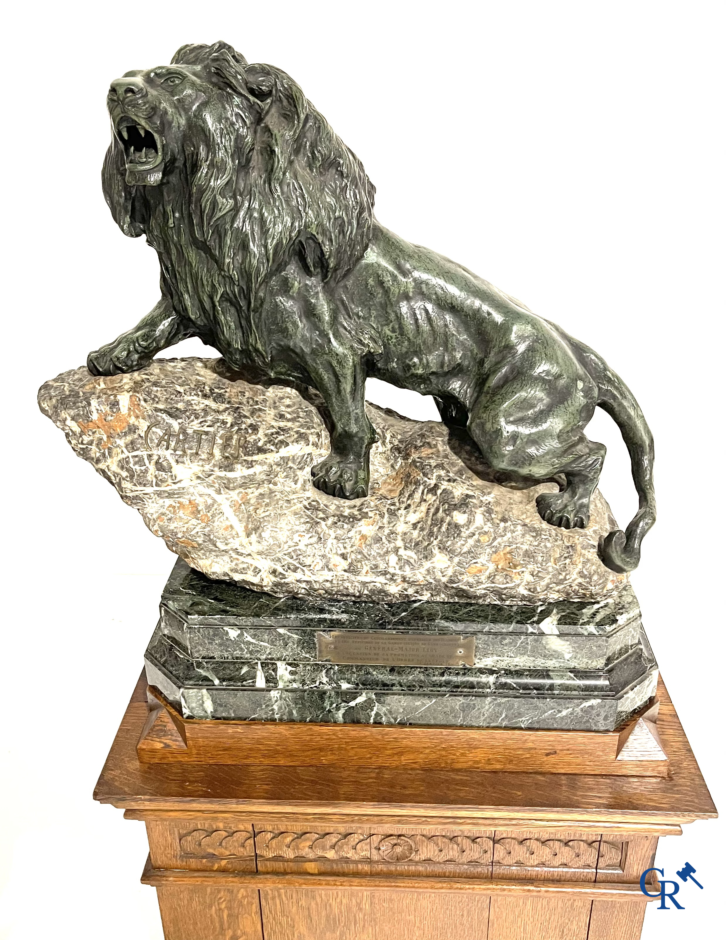Thomas François Cartier (1879-1936) "Roaring lion" Important statue in bronze and stone on a wooden base.