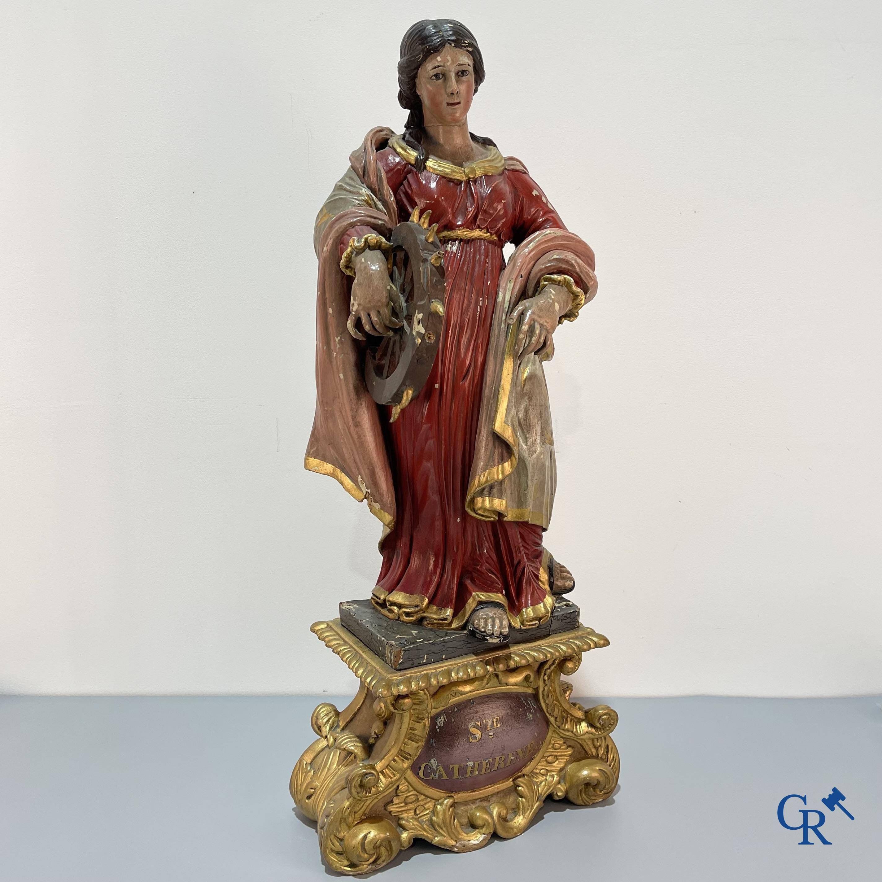 Religious objects, a finely carved and polychrome wooden statue of Saint Catherine in Baroque style. 18th century.