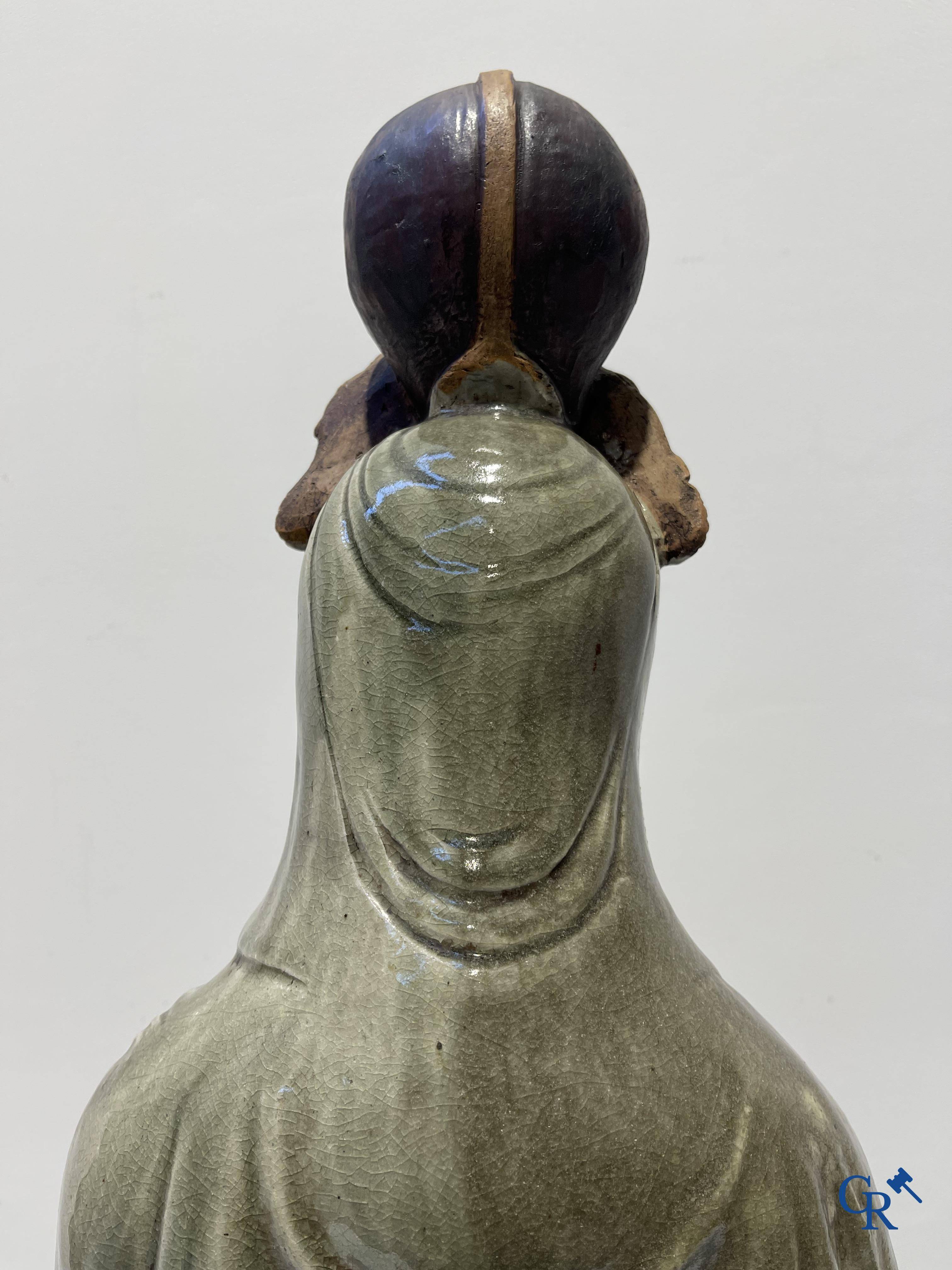 Asian Art, an imposing Shiwan earthenware figure of Guanyin.