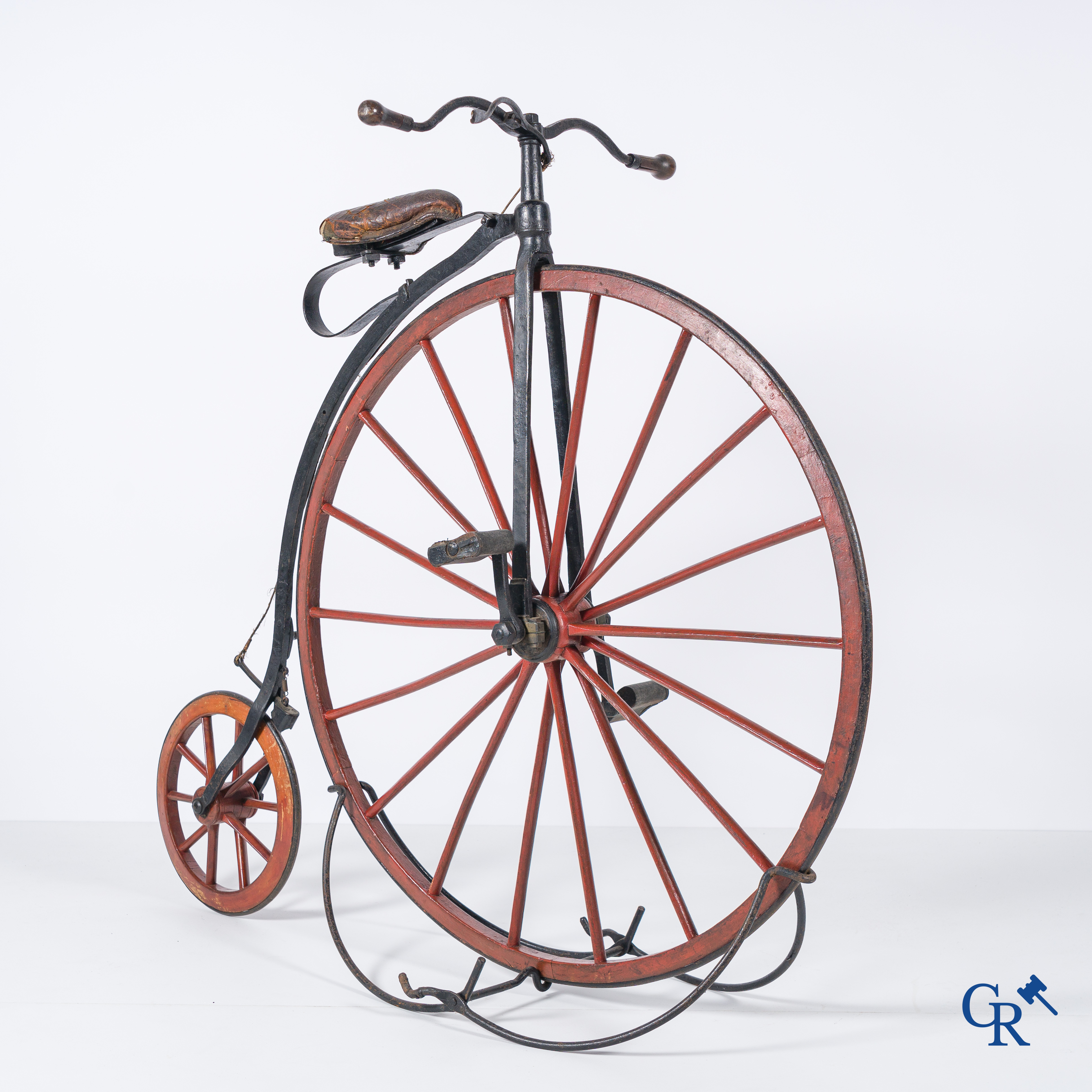 Penny-farthing with wooden spoked wheels on the original wrought iron upright. Circa 1880.