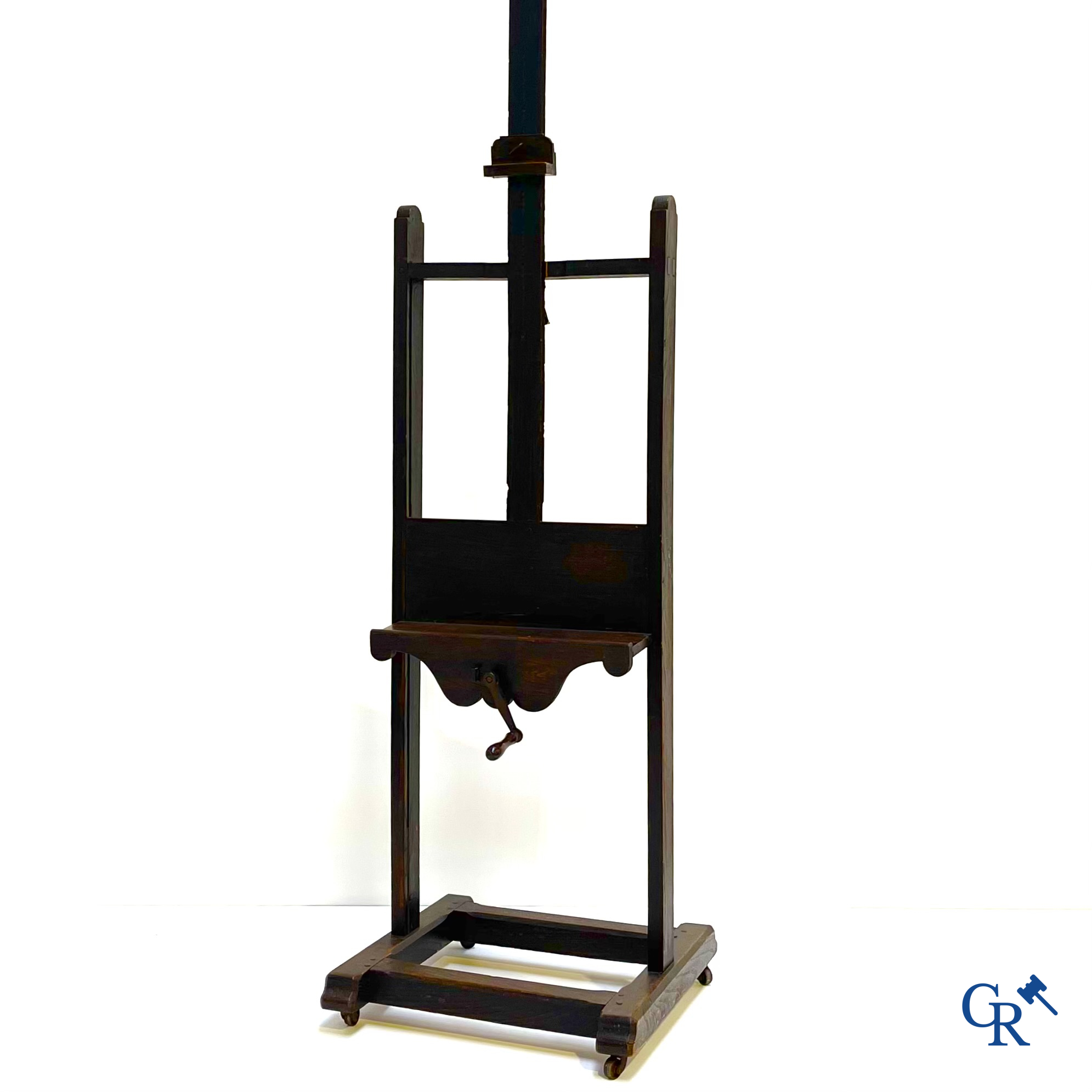 A large antique painter's studio easel with crank adjustment system. 19th century.