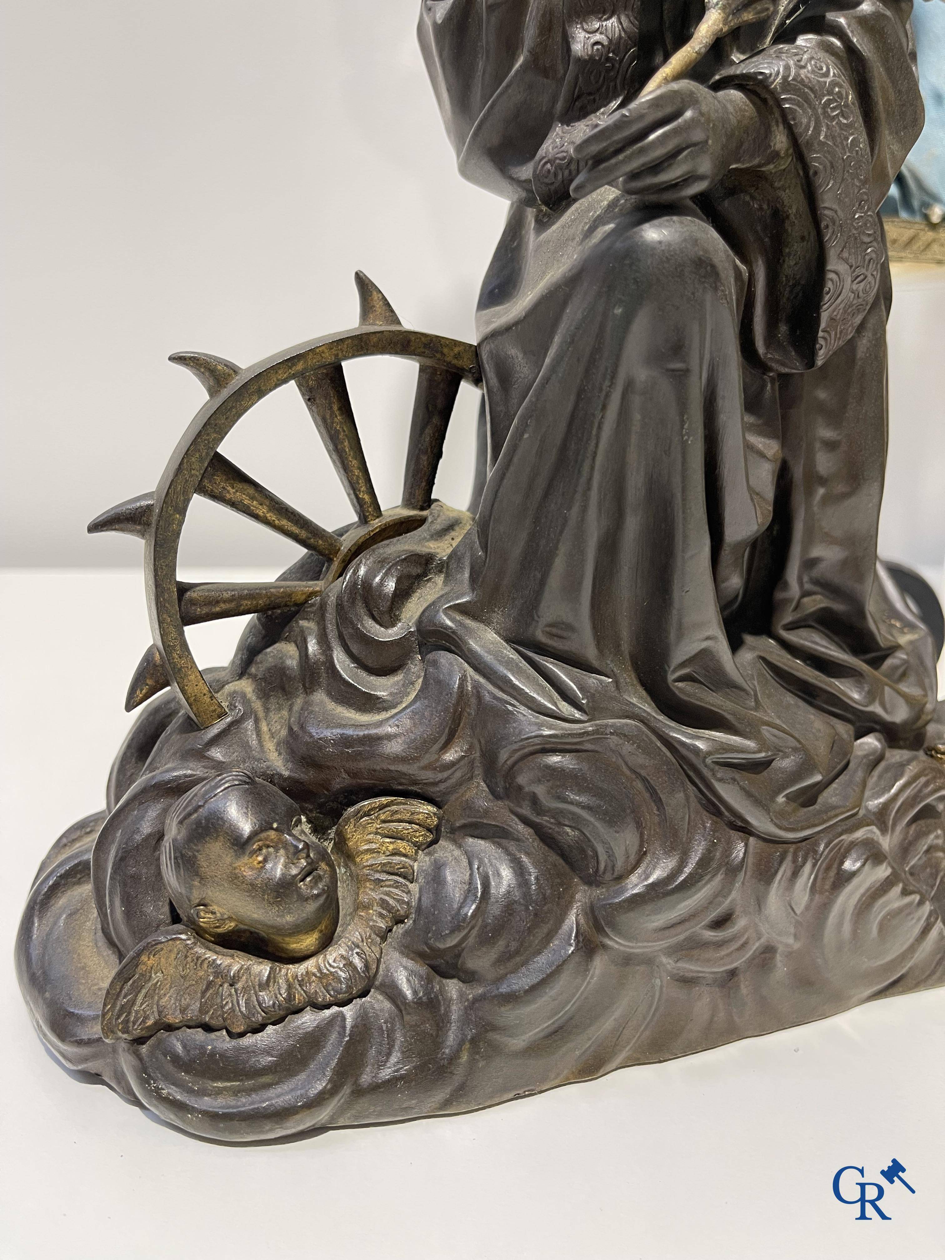 A lot with brocante: Bronze clock, bronze neo Gothic candlesticks and a statue of St. Catharina, soliflore etc.