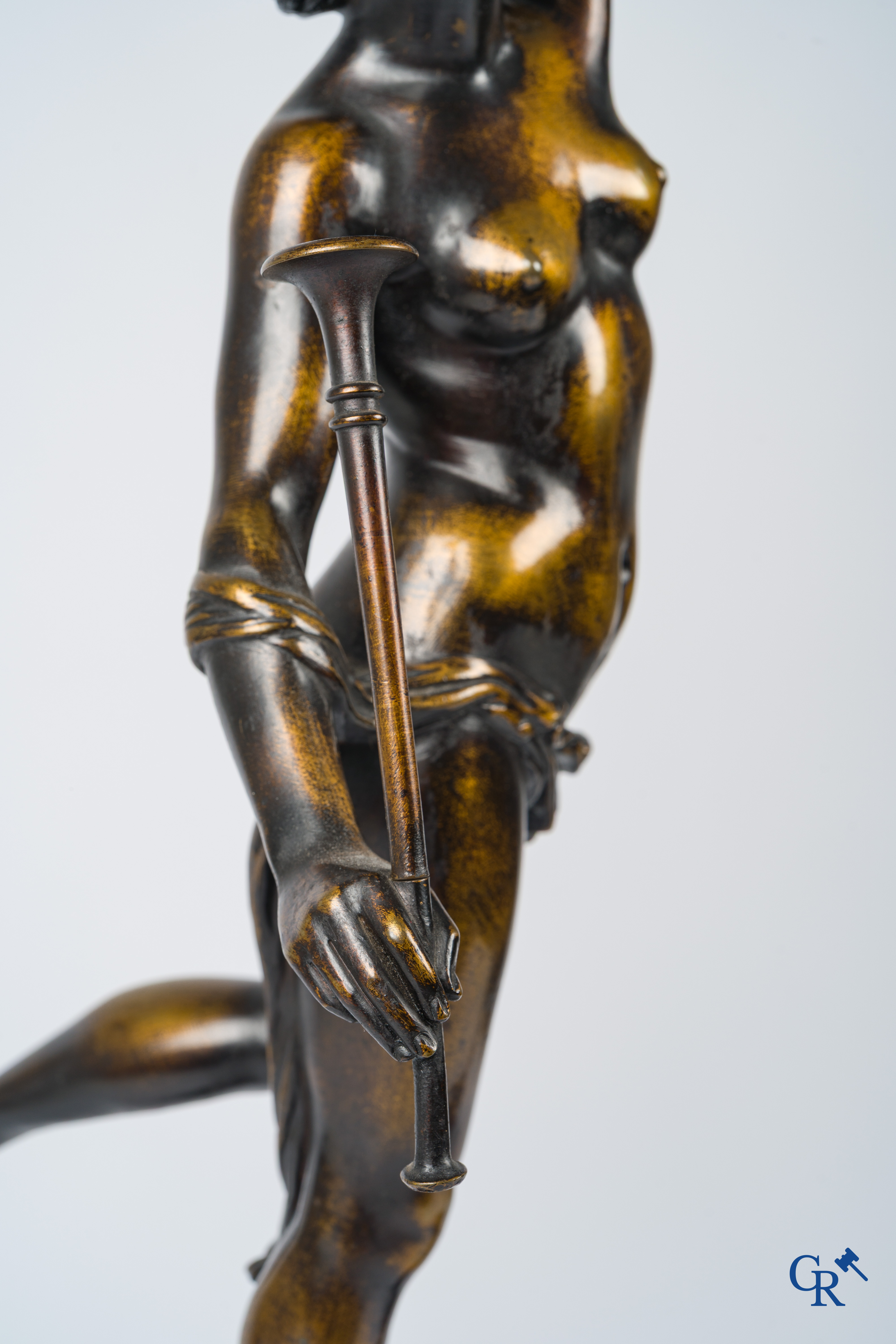 A pair of imposing bronze statues in the antique style after a model by Jean De Bologne.