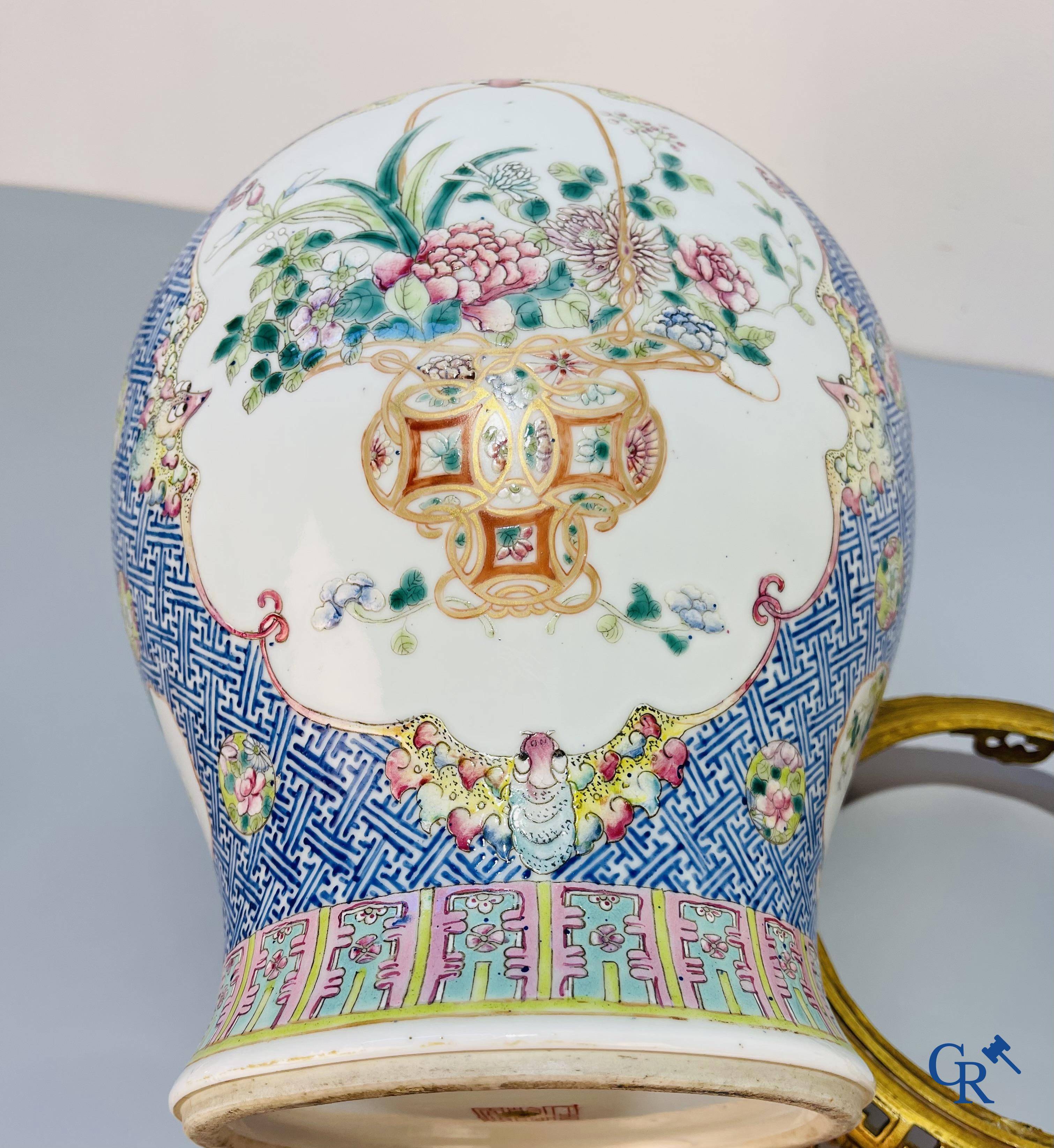 Asian Art, Chinese porcelain, a finely decorated Chinese famille rose vase with bronze. 19th century.
