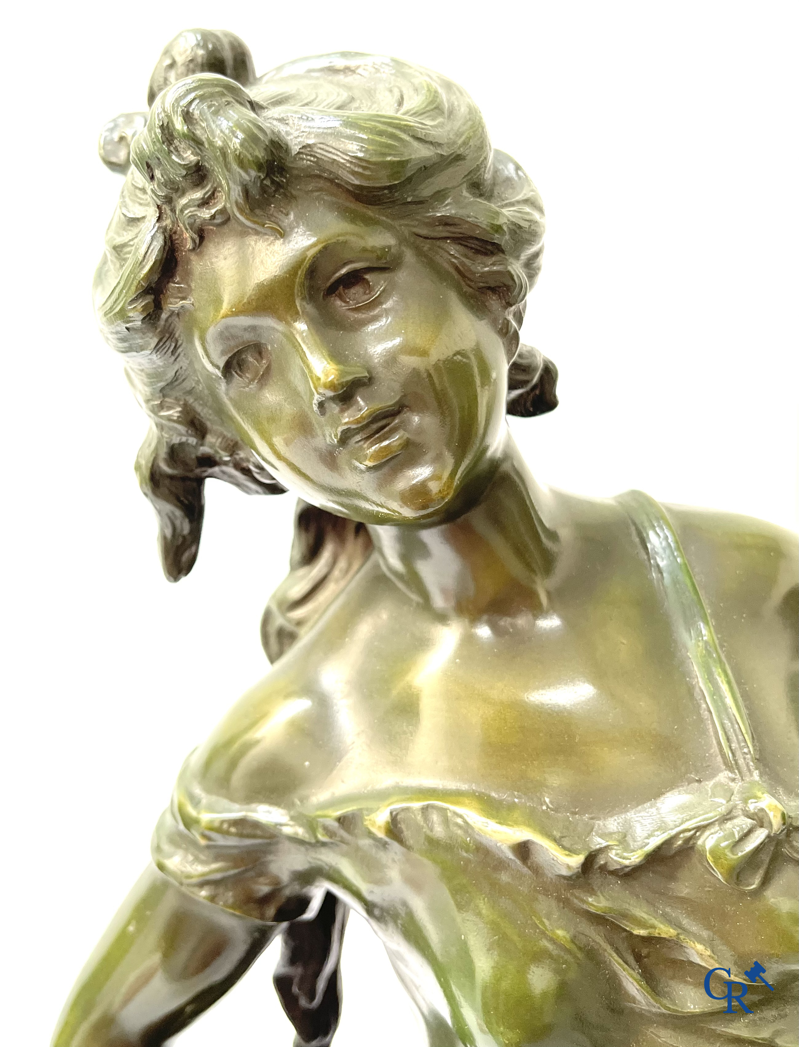 Louis & François Moreau, A large pair of statues in green patinated spelter on a wooden base. Signed L&F Moreau.