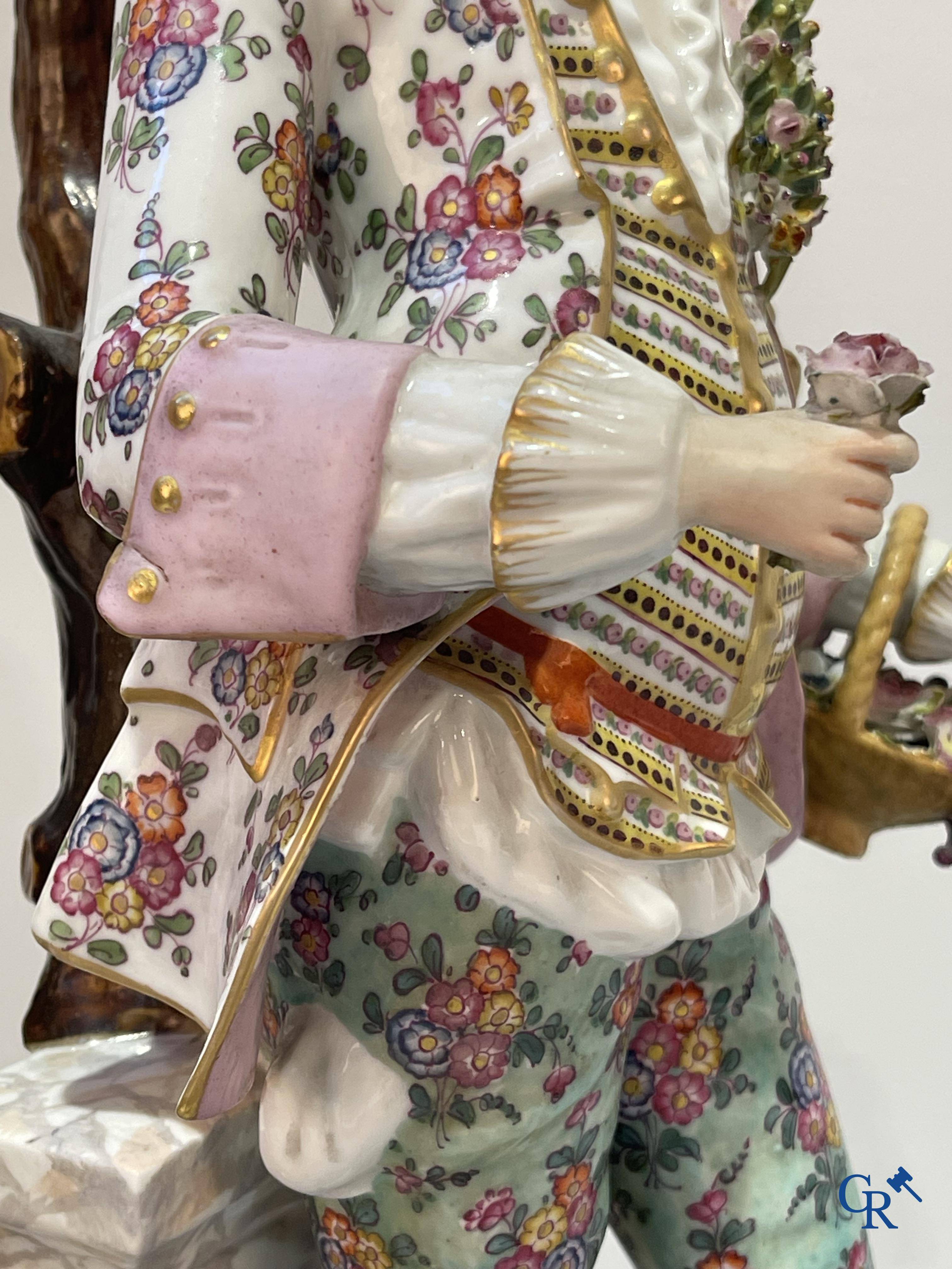 European porcelain, Meissen, a couple in finely polychromed German porcelain. Marked with the swords.